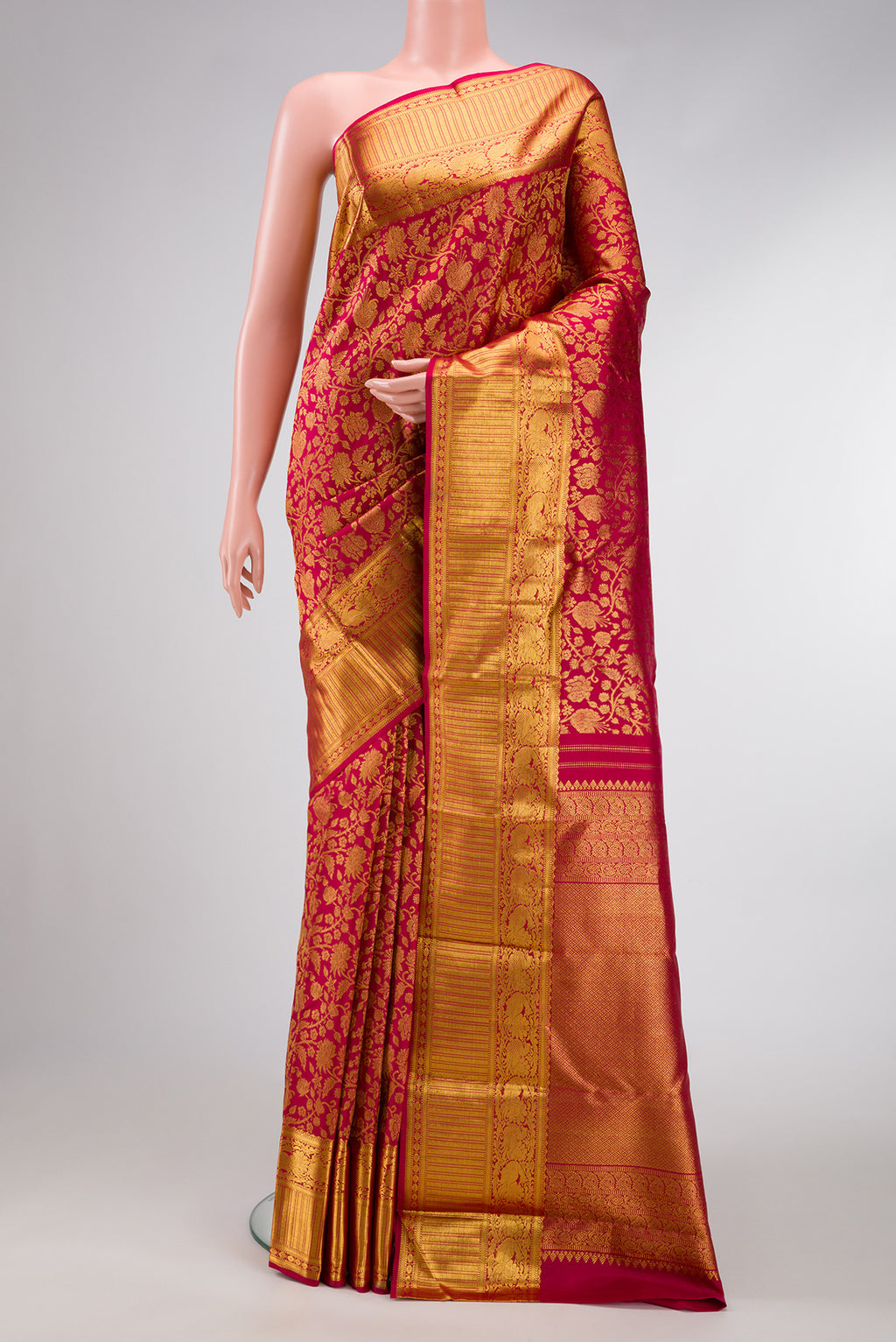 Maroon Dual Tone Kanchipuram Silk Saree with Zari Brocade on the body and Zari Border.  displayed on a mannequin