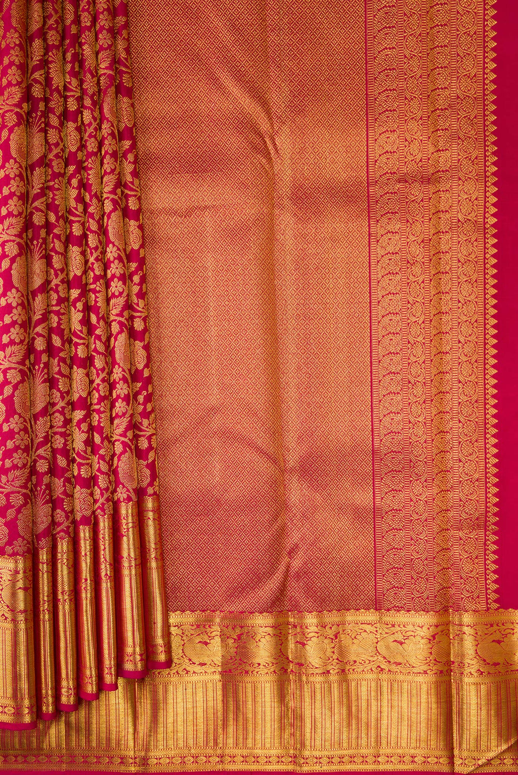 Pleats and pallu of Maroon Dual Tone Kanchipuram Silk Saree with Zari Brocade on the body and Zari Border. 