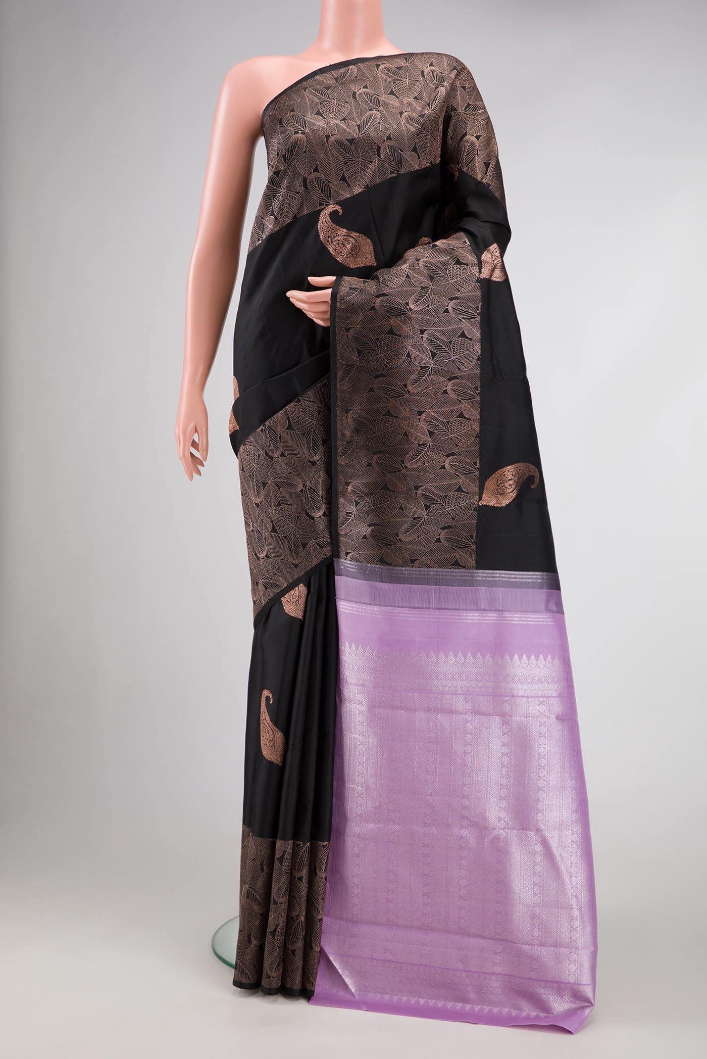 Pure Silk Pure Zari Black Dual Tone Kanchipuram Saree with Zari Butta on the body and Fancy Border.  displayed on a mannequin