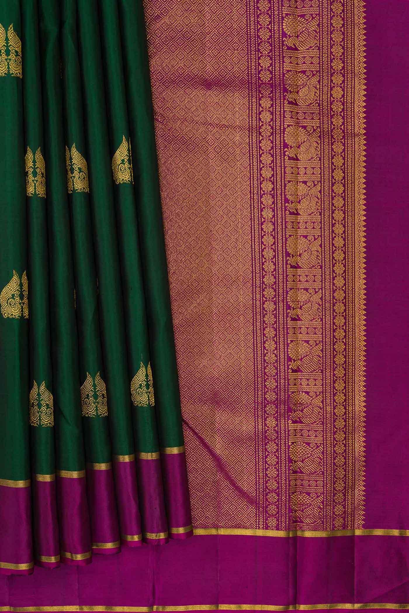 Pleats and pallu of Green Dual Tone Kanchipuram Silk Saree with Zari Butta on the body and Zari Border