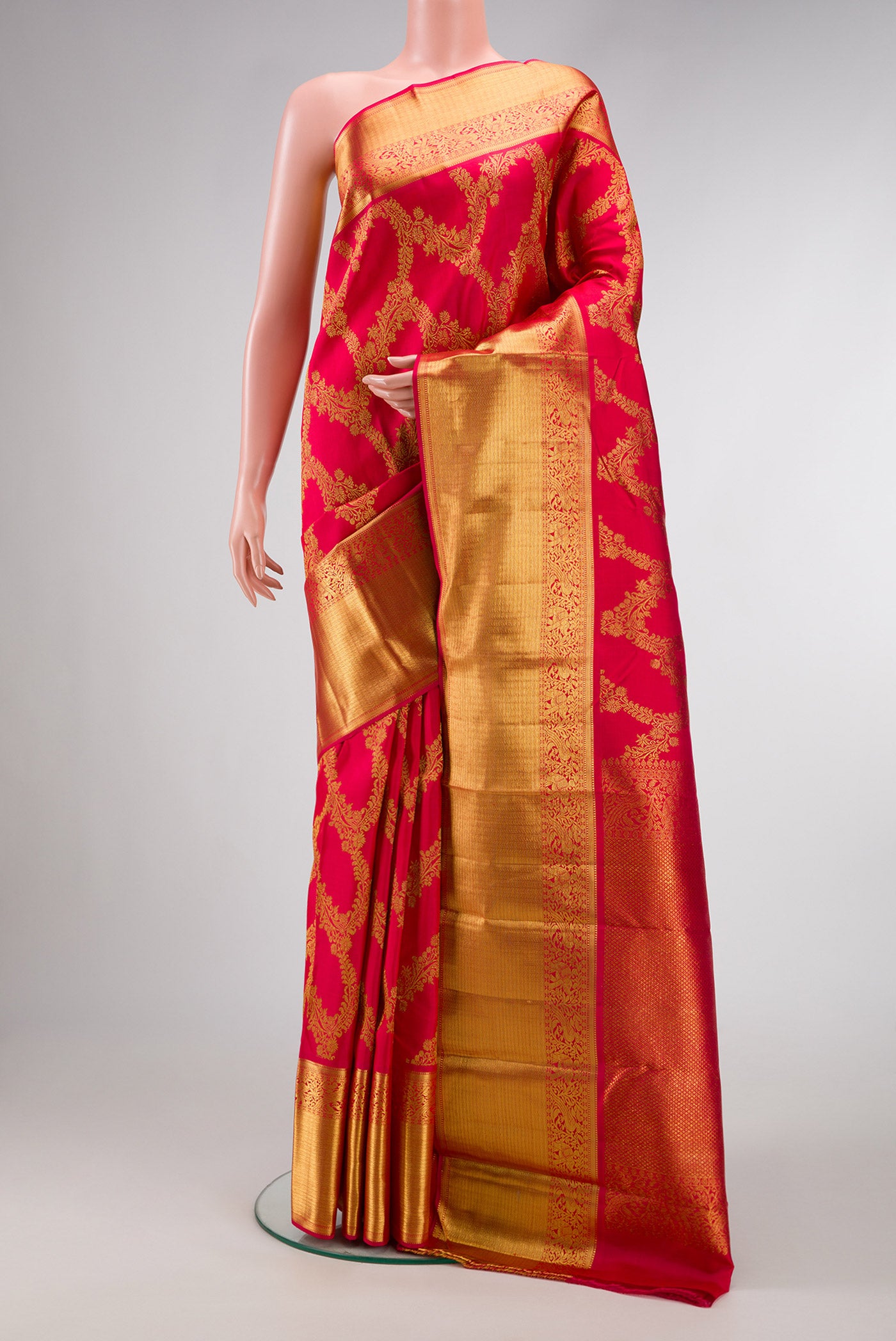 Dark Pink Dual Tone Kanjivaram Silk Saree with Zari Butta on the body and Zari Border.  displayed on a mannequin