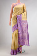Gold Dual Tone Kanjivaram Tissue Silk Saree with Zari Brocade on the body and Zari And Thread Border.  displayed on a mannequin