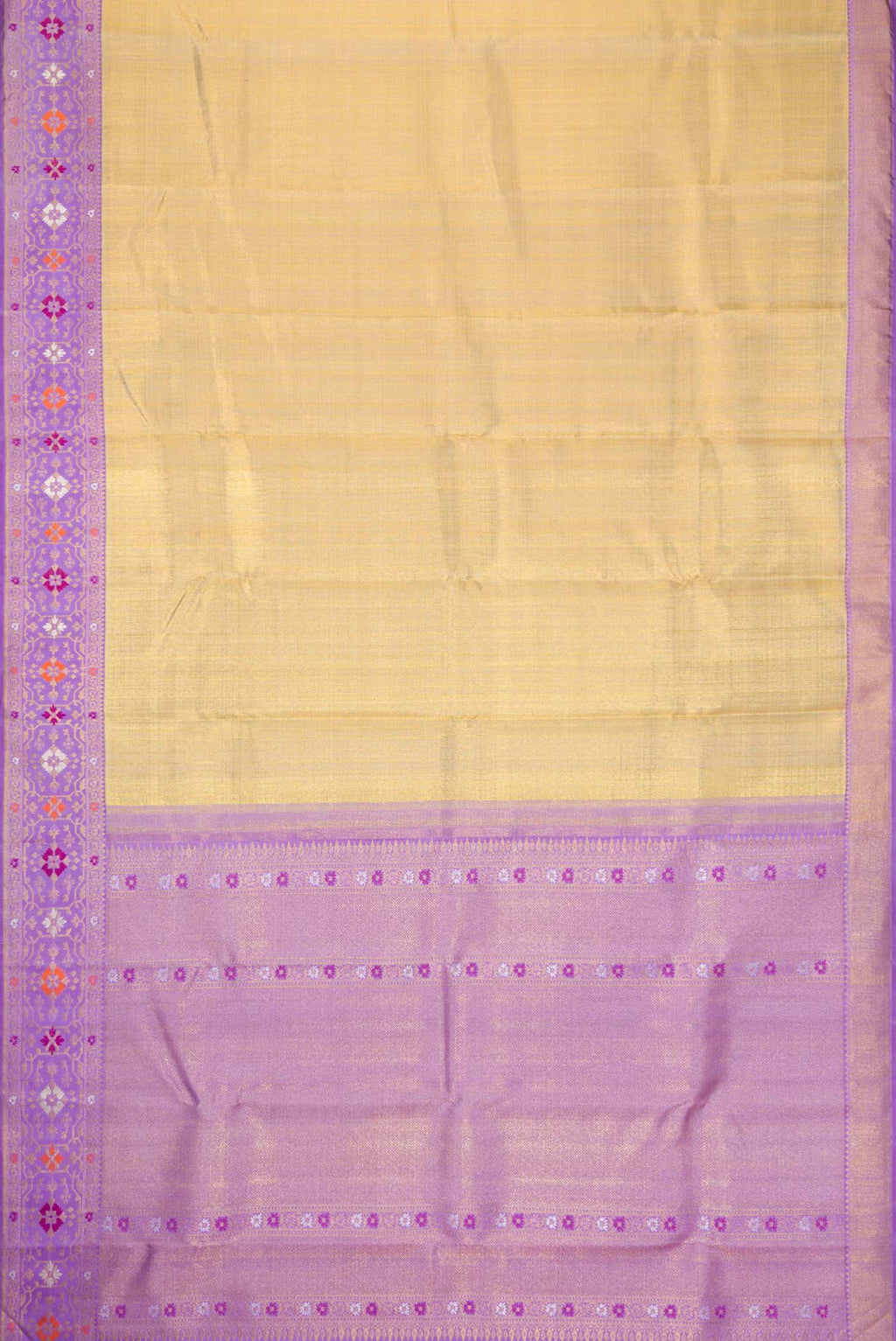 Flat view of Gold Dual Tone Kanjivaram Tissue Silk Saree with Zari Brocade on the body and Zari And Thread Border. 