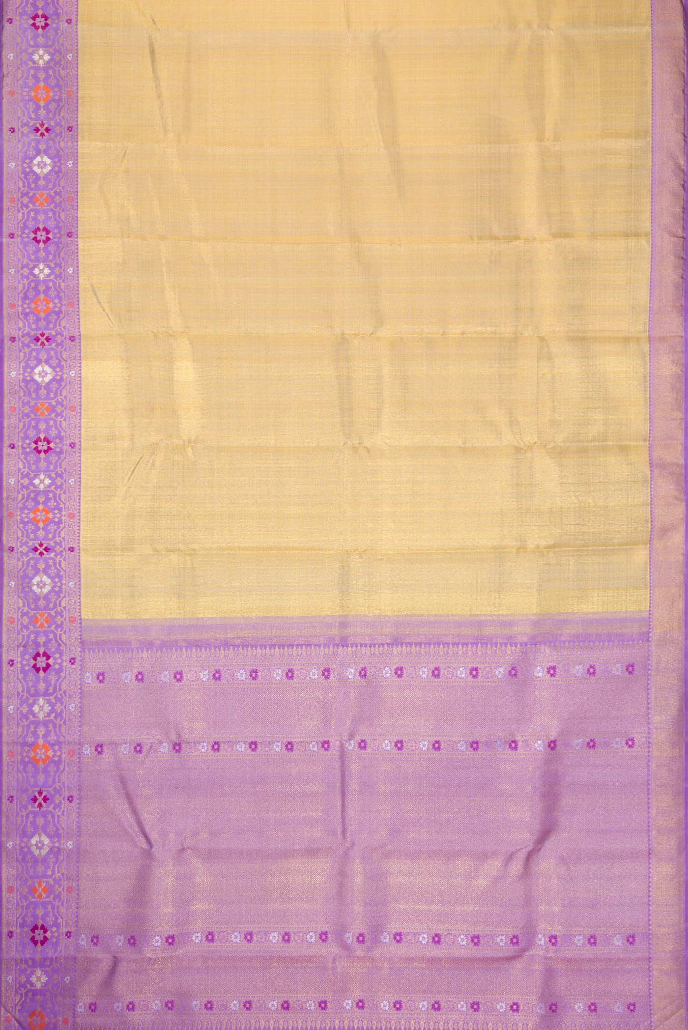 Flat view of Gold Dual Tone Kanjivaram Tissue Silk Saree with Zari Brocade on the body and Zari And Thread Border. 