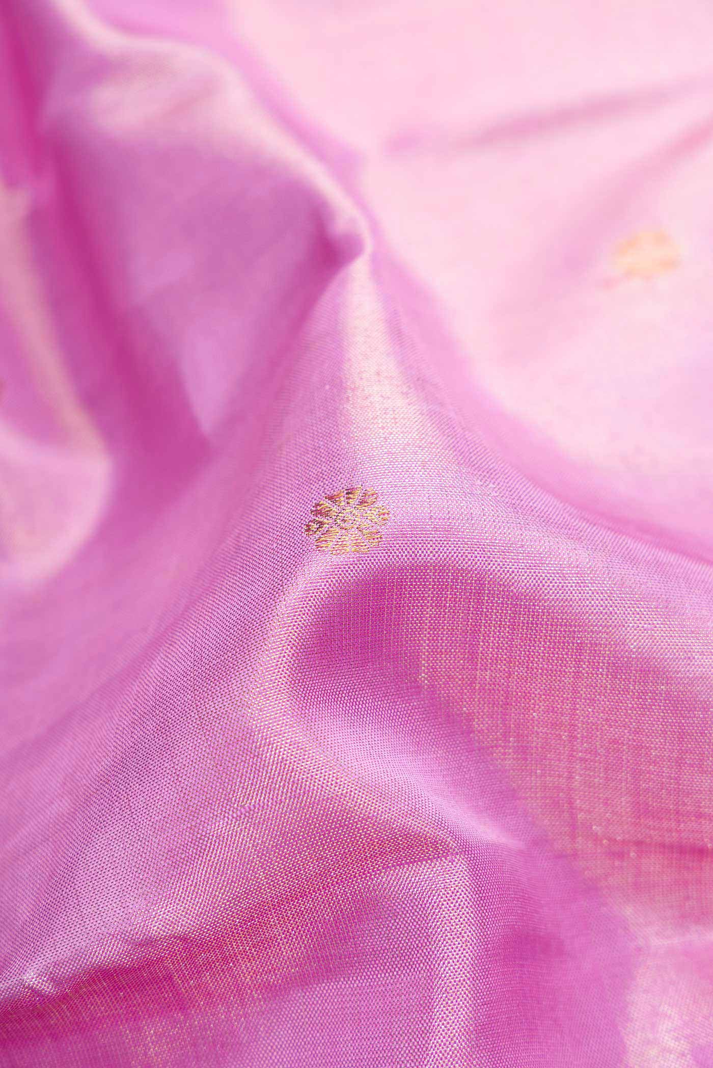 Close up of Lavender Dual Tone Kanjivaram Tissue Silk Saree with Zari Brocade on the body and Zari Border.  displaying folds