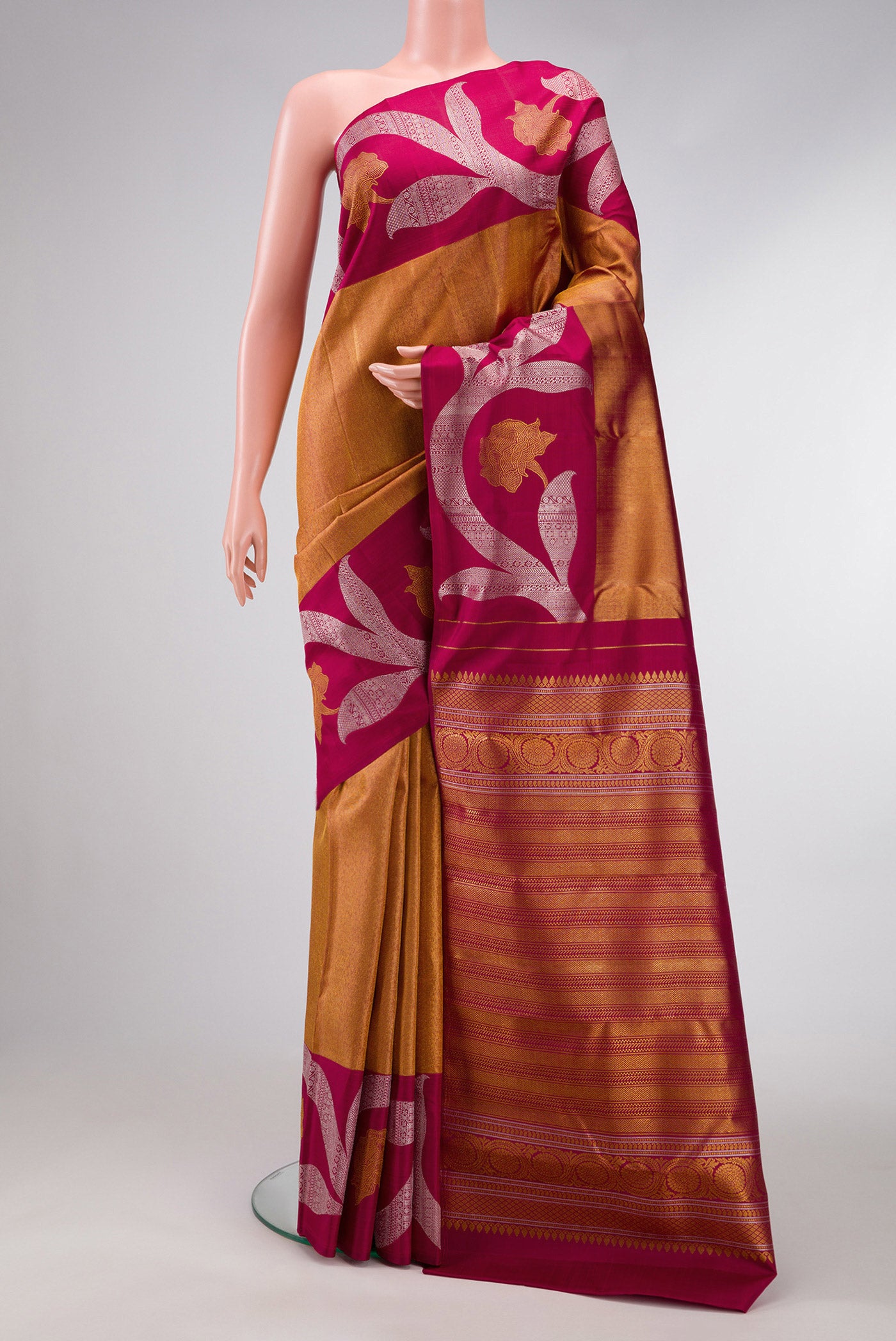 Maroon Dual Tone Kanjivaram Silk Saree with Zari Brocade on the body and Zari Border.  displayed on a mannequin