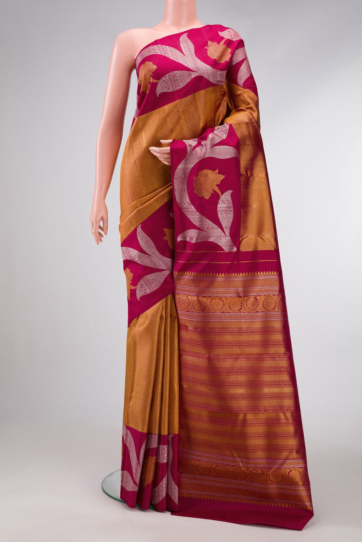 Maroon Dual Tone Kanjivaram Silk Saree with Zari Brocade on the body and Zari Border.  displayed on a mannequin