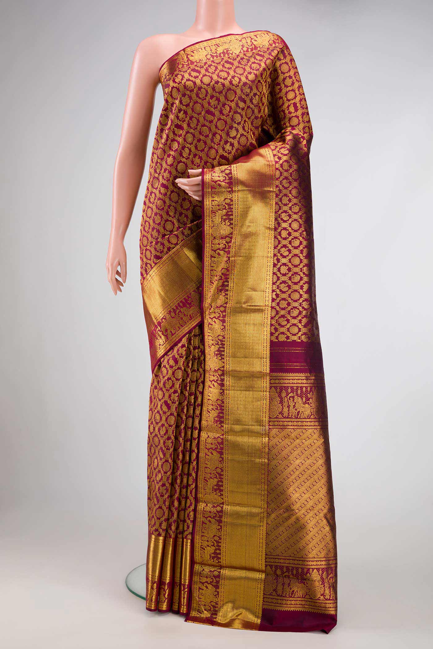 Maroon Dual Tone Kanchipuram Silk Saree with Zari Brocade on the body and Zari Border.  displayed on a mannequin
