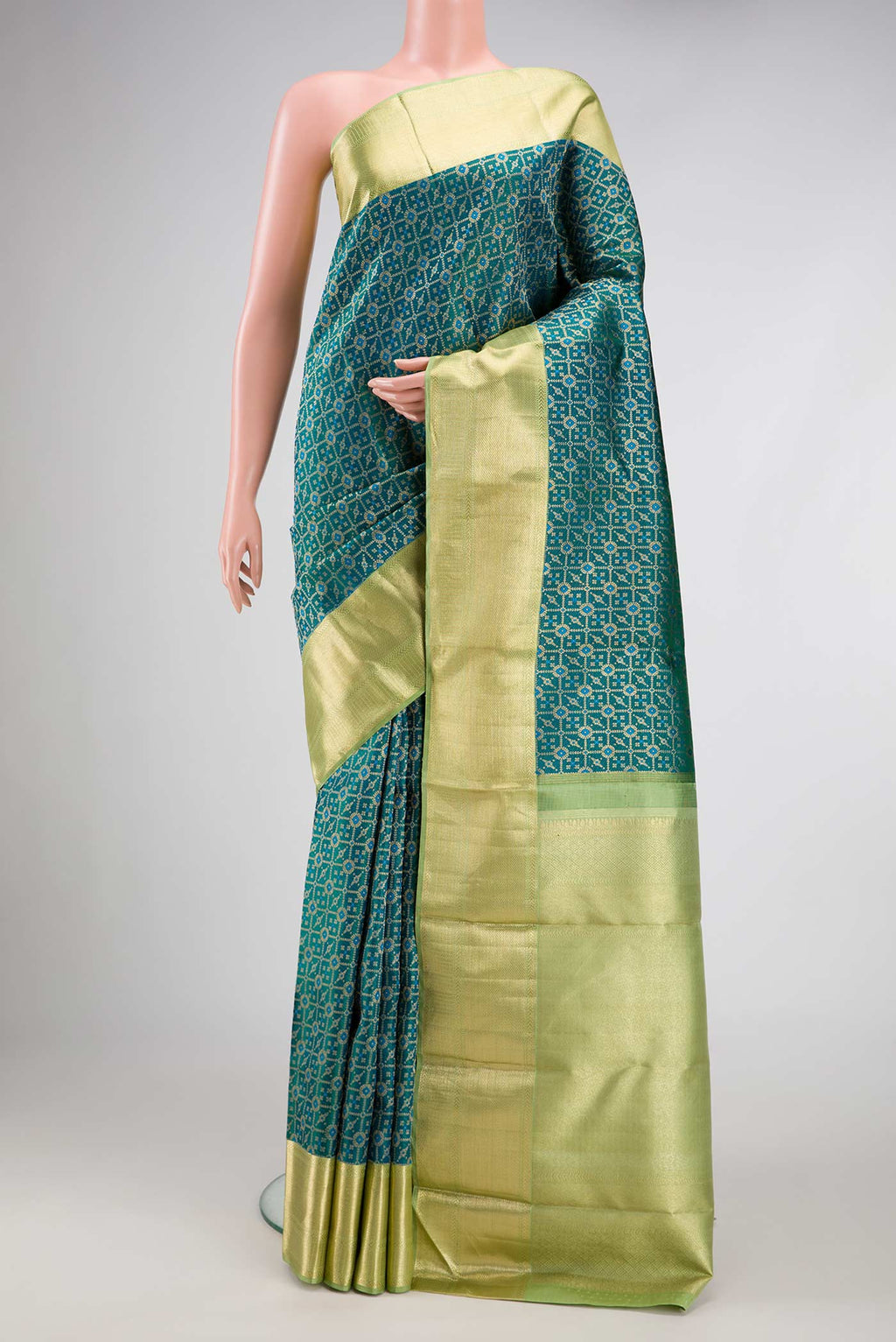 Peacock Blue Dual Tone Kanchipuram Silk Saree with Zari Brocade on the body and Zari Border.  displayed on a mannequin