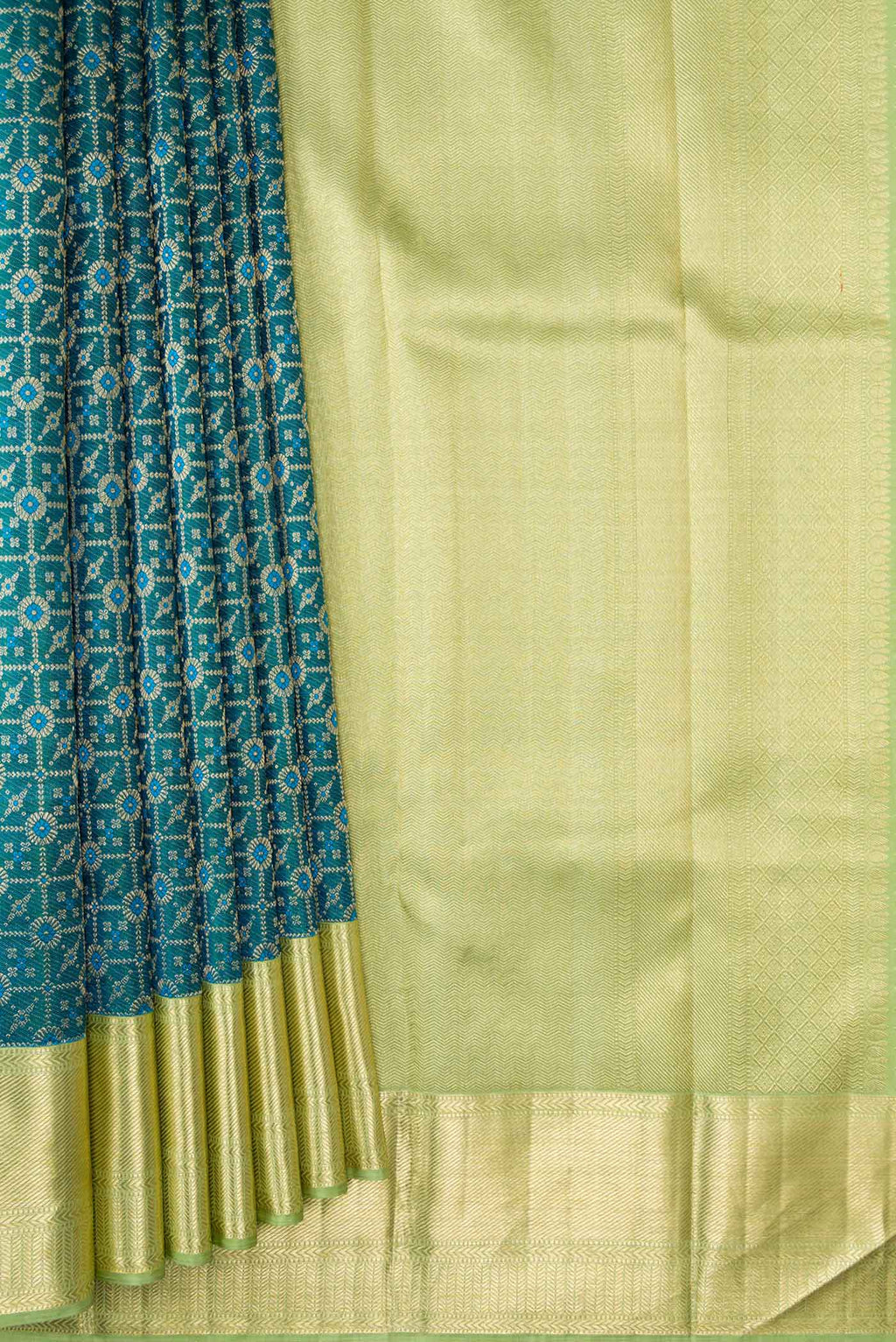 Pleats and pallu of Peacock Blue Dual Tone Kanchipuram Silk Saree with Zari Brocade on the body and Zari Border. 