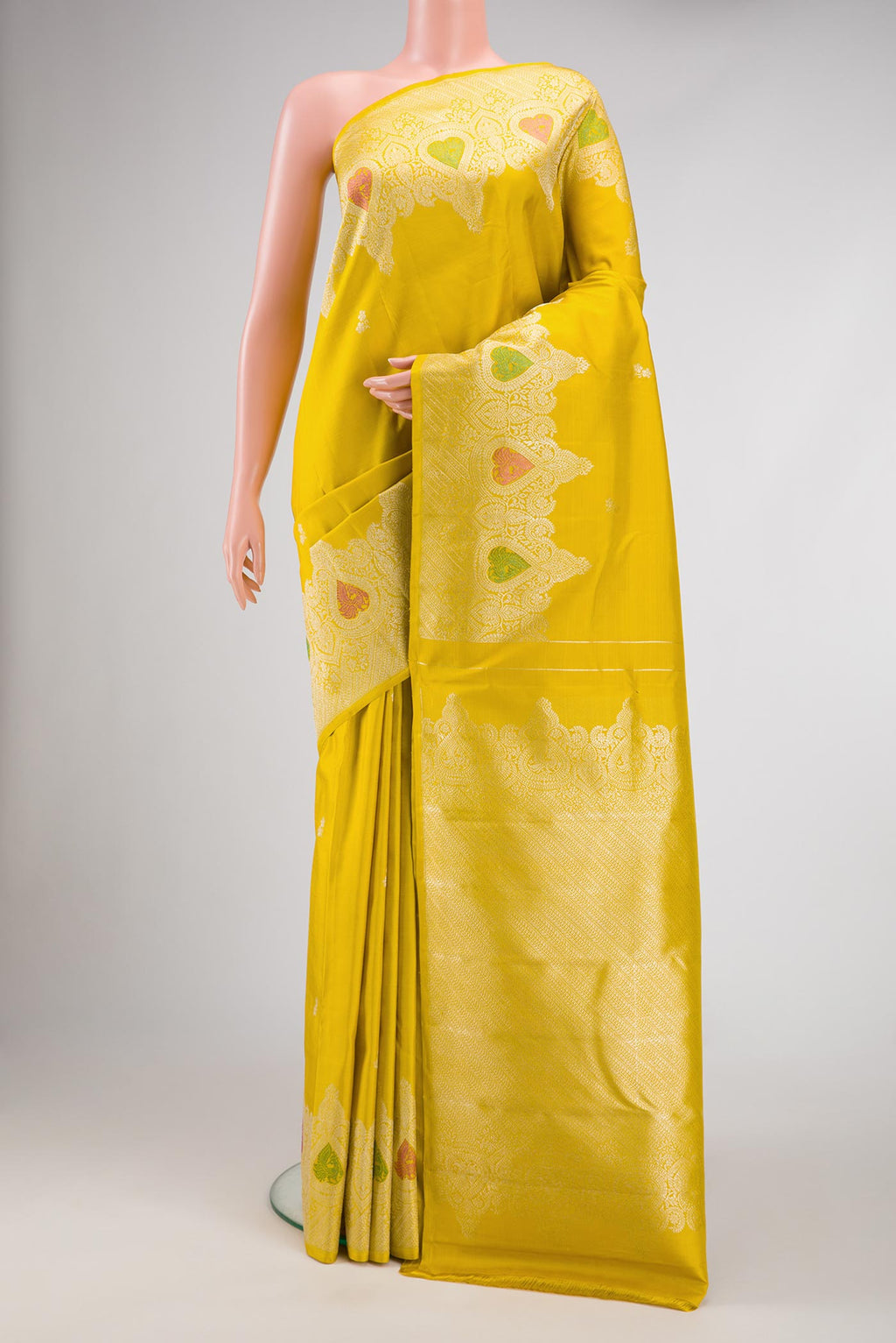 Pure Silk Pure Zari Yellow Dual Tone Kanchipuram Saree with Zari Butta on the body and Fancy Border.  displayed on a mannequin