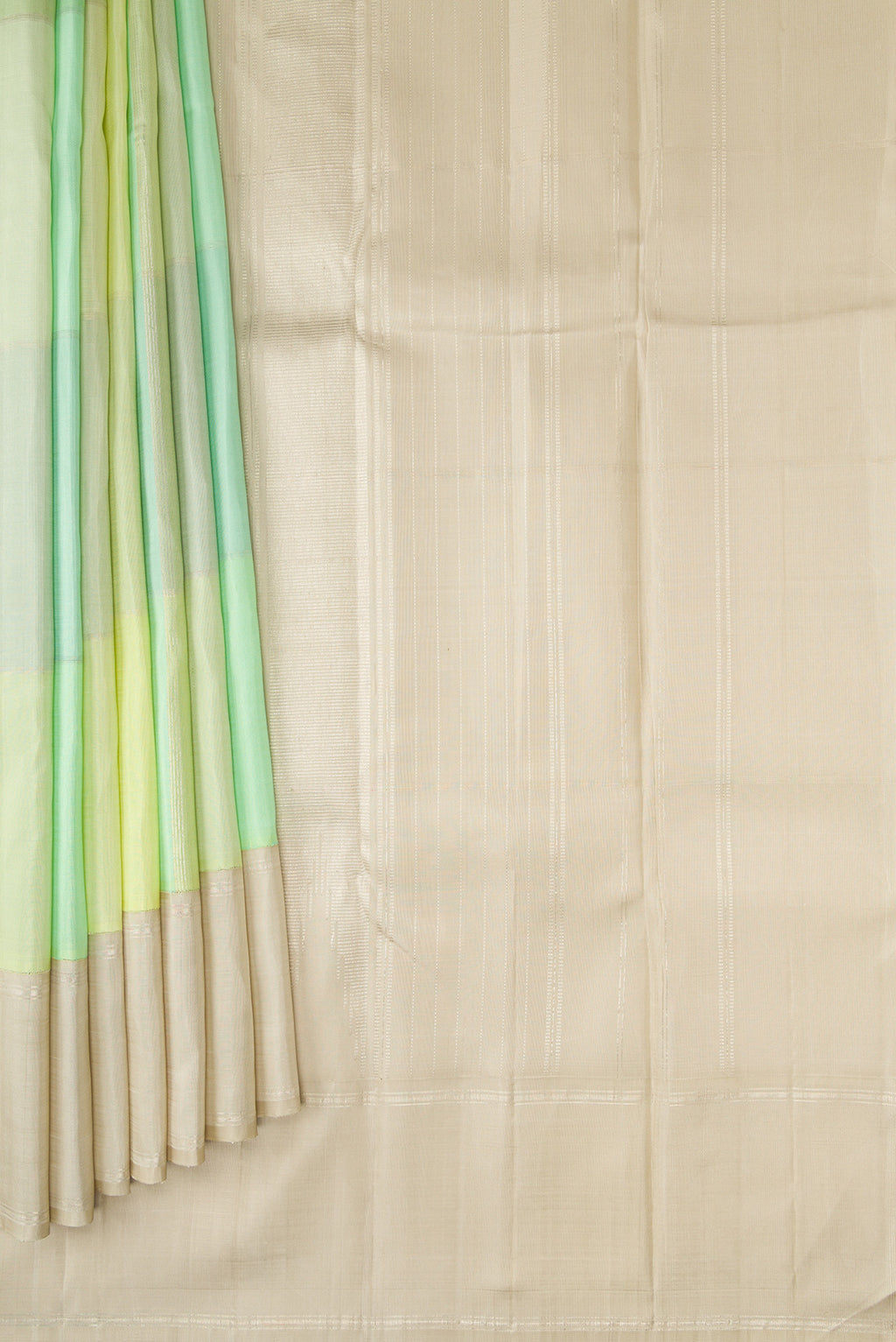 Pleats and pallu of Light Green and Sea Green Color Kanchipuram Silk Saree with Checked design on the body and Zari Border. 