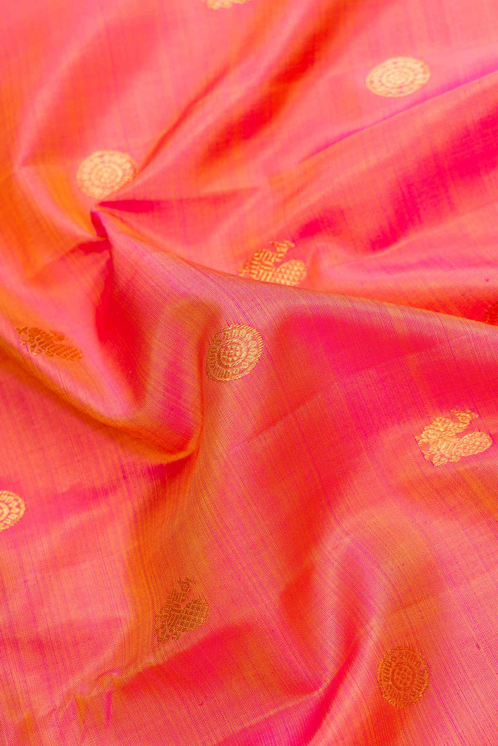 Close up of Mustard Dual Tone Kanjivaram Silk Saree with Zari Butta on the body and Zari Border.  displaying folds
