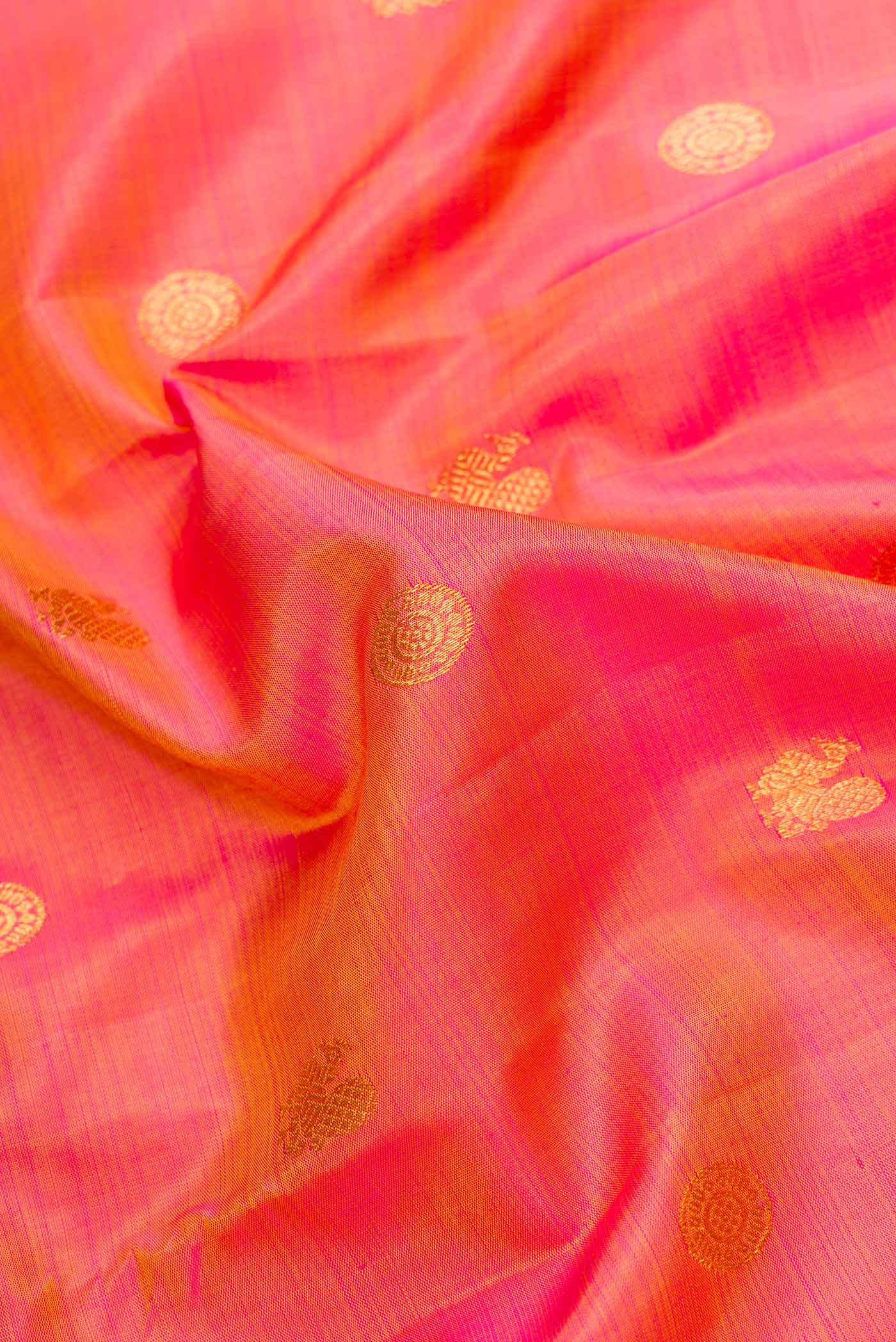 Close up of Mustard Dual Tone Kanjivaram Silk Saree with Zari Butta on the body and Zari Border.  displaying folds