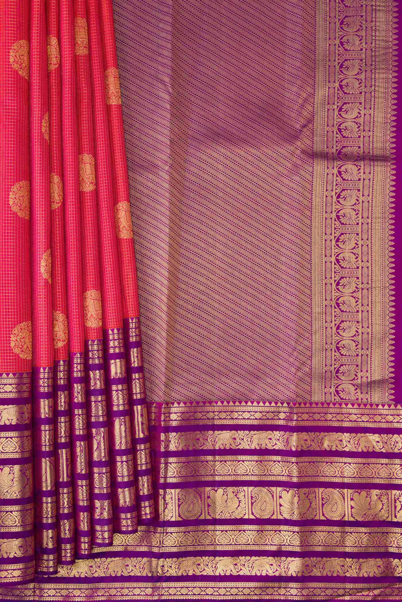 Pleats and pallu of Coral Dual Tone Kanjivaram Silk Saree with Zari Butta on the body and Zari Border. 