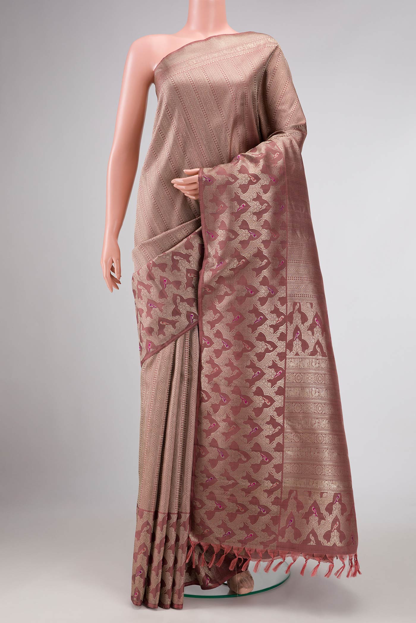 Pure Silk Pure Zari Brown Dual Tone Kanchipuram Saree with Zari Brocade on the body and Fancy Border displayed on a mannequin