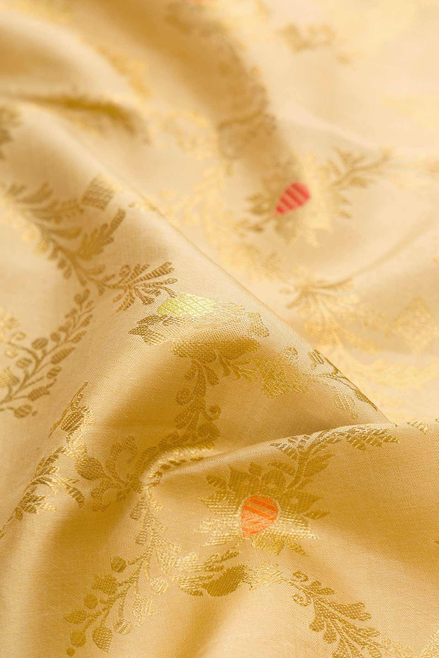 Close up of Pure Silk Pure Zari Beige Dual Tone Kanchipuram Saree with Zari Brocade on the body and Zari Border displaying folds