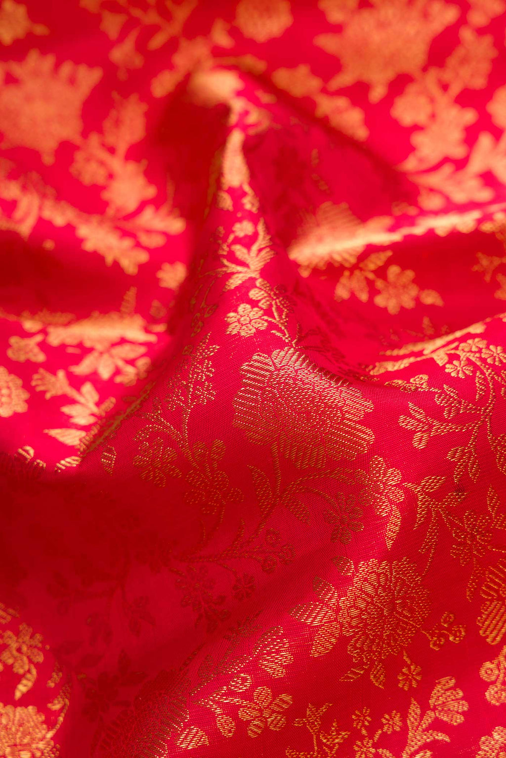 Close up of Pure Silk Pure Zari Maroon Dual Tone Kanjivaram Saree with Zari Brocade on the body and Zari Border.  displaying folds