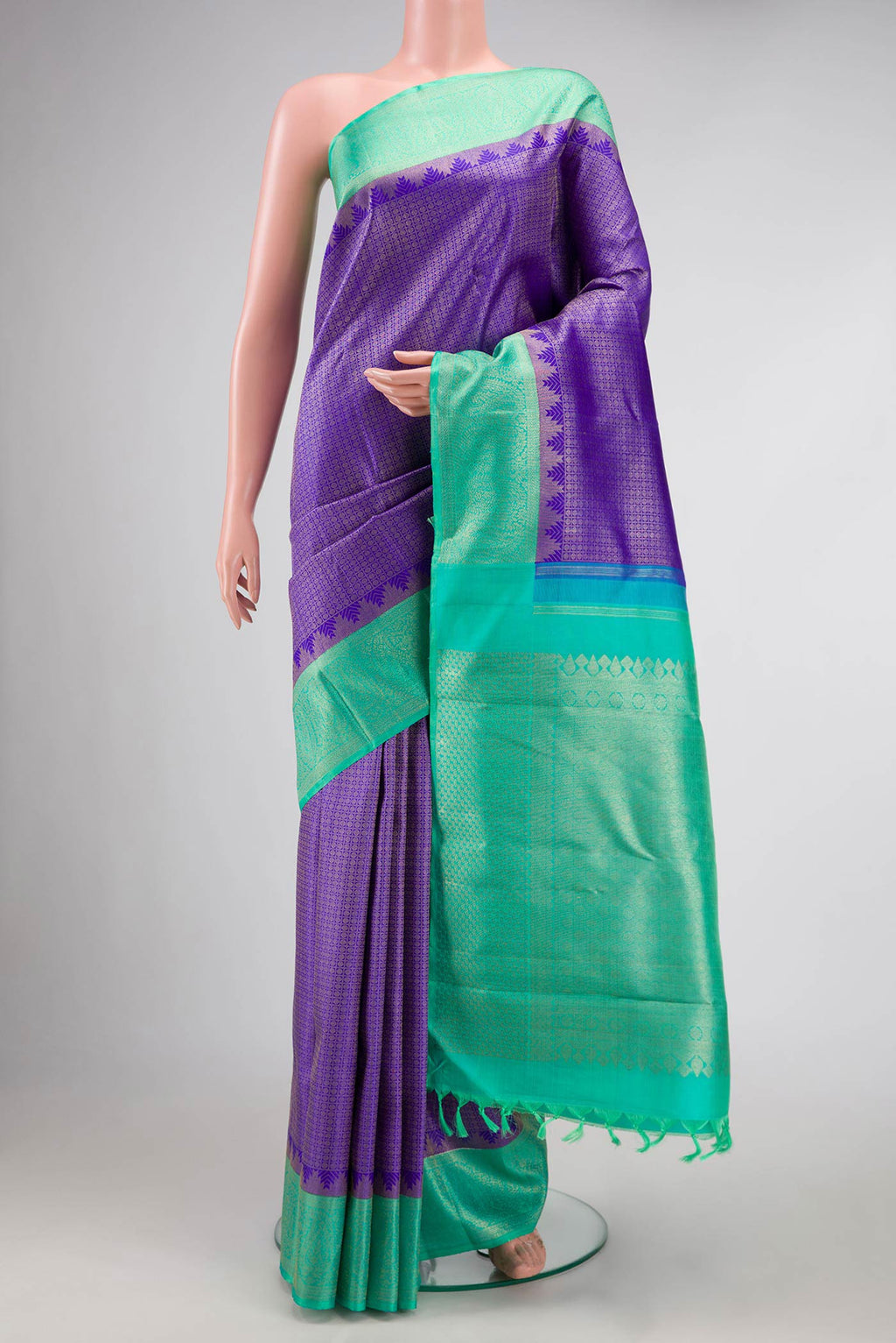 Pure Silk Pure Zari Royal Blue Dual Tone Kanchipuram Saree with Zari Brocade on the body and Zari Border displayed on a mannequin