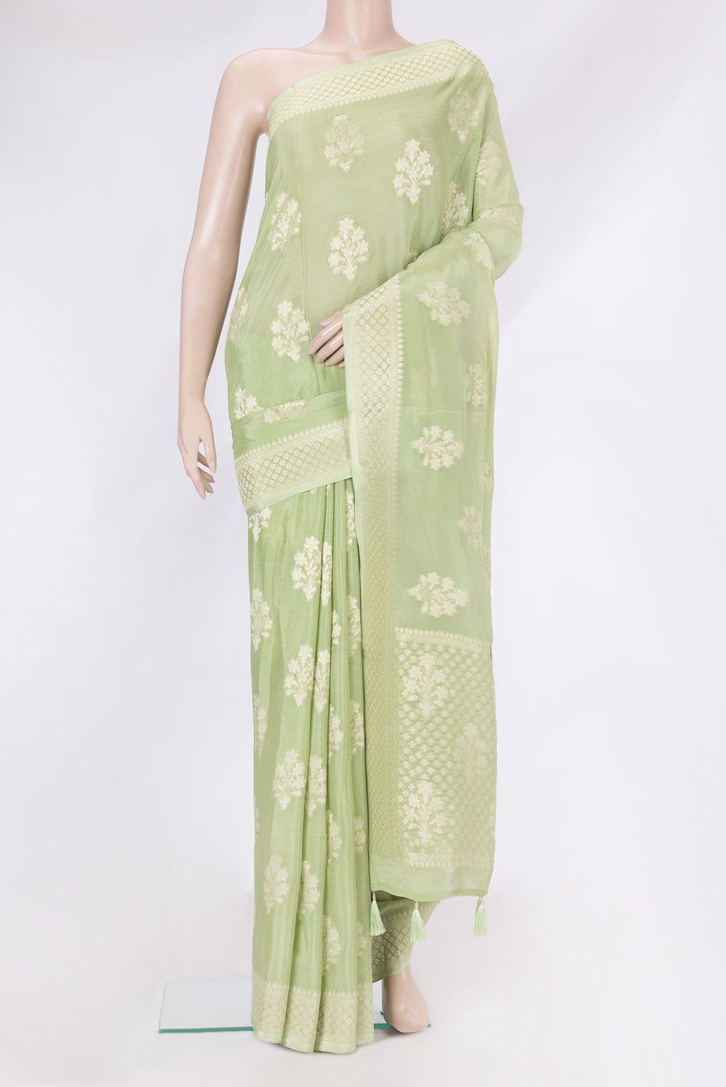 Pista Green Dual Tone Blended Banarasi Silk Saree with Zari Butta on the body and Zari Border.  displayed on a mannequin