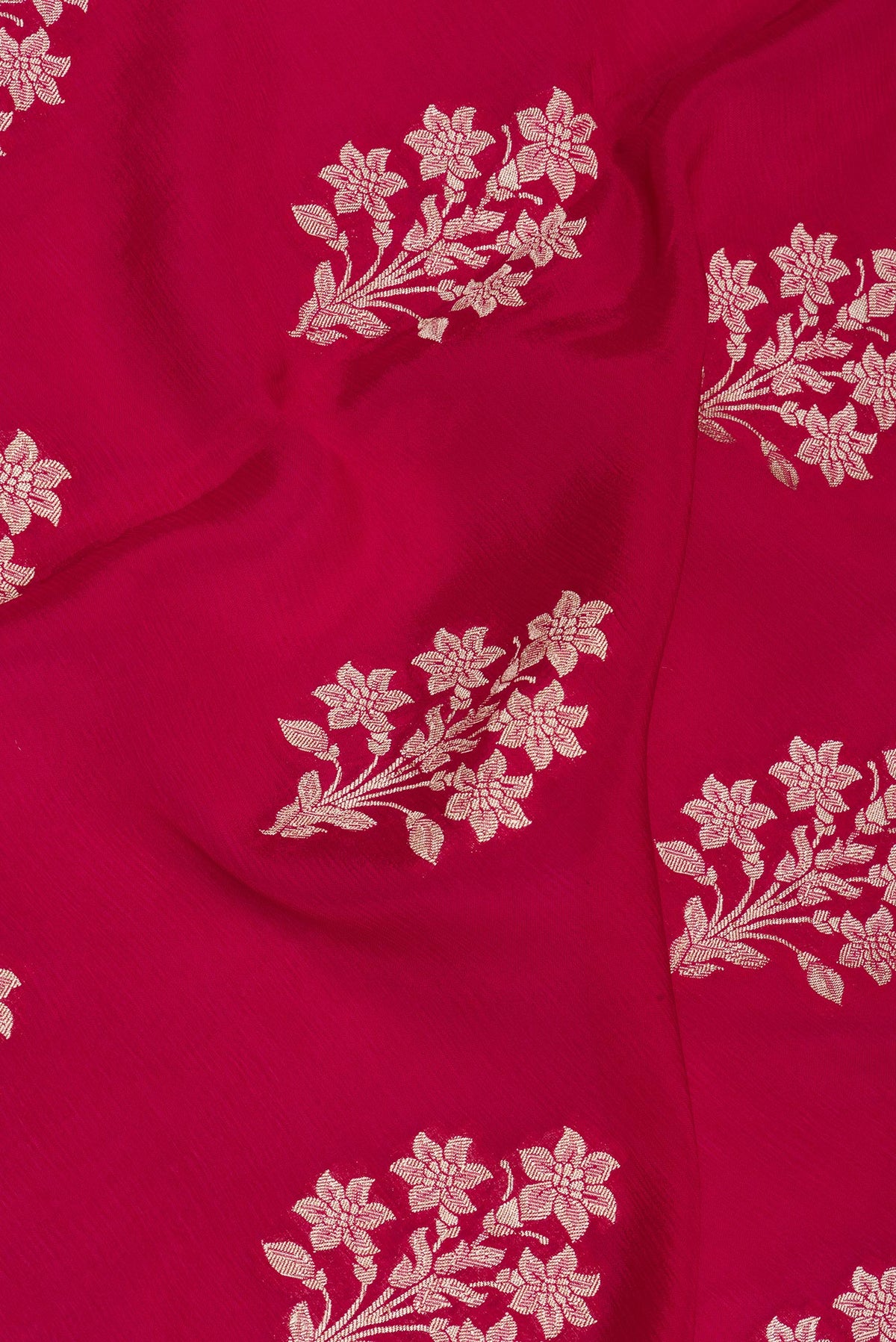 Close up of Dark Pink Dual Tone Blended Banarasi Silk Saree with Zari Butta on the body and Zari Border.  displaying folds