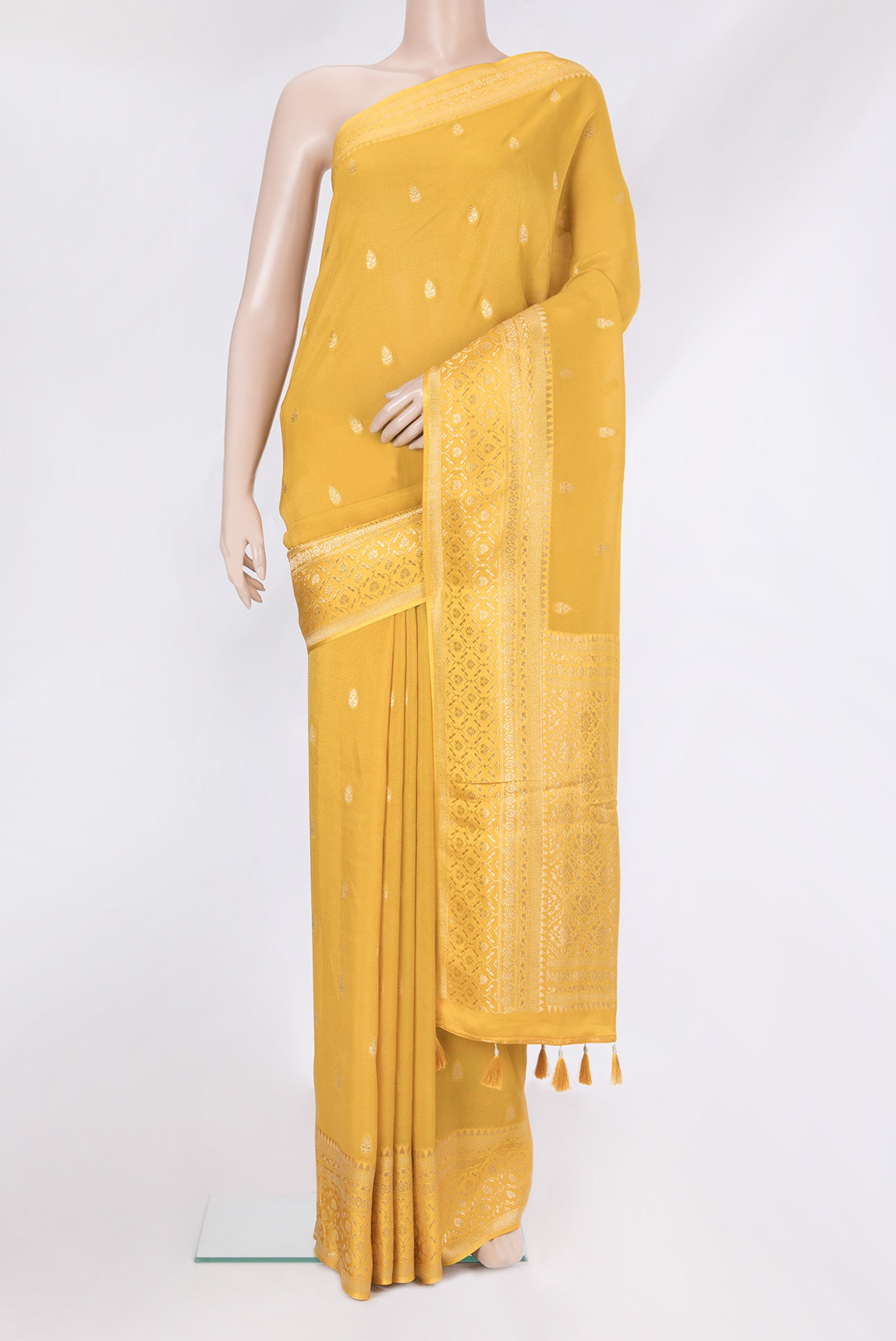 Mustard Blended Banarasi Silk Saree with Zari Butta on the body and Zari Border.  displayed on a mannequin