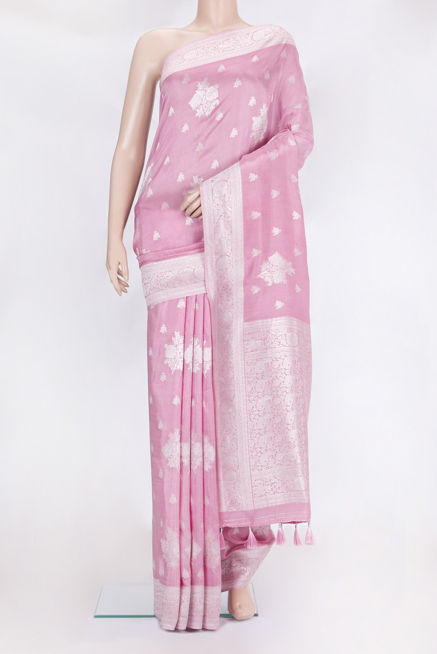 Rose pink Blended Banarasi Silk Saree with Zari Butta on the body and Fancy Border.  displayed on a mannequin