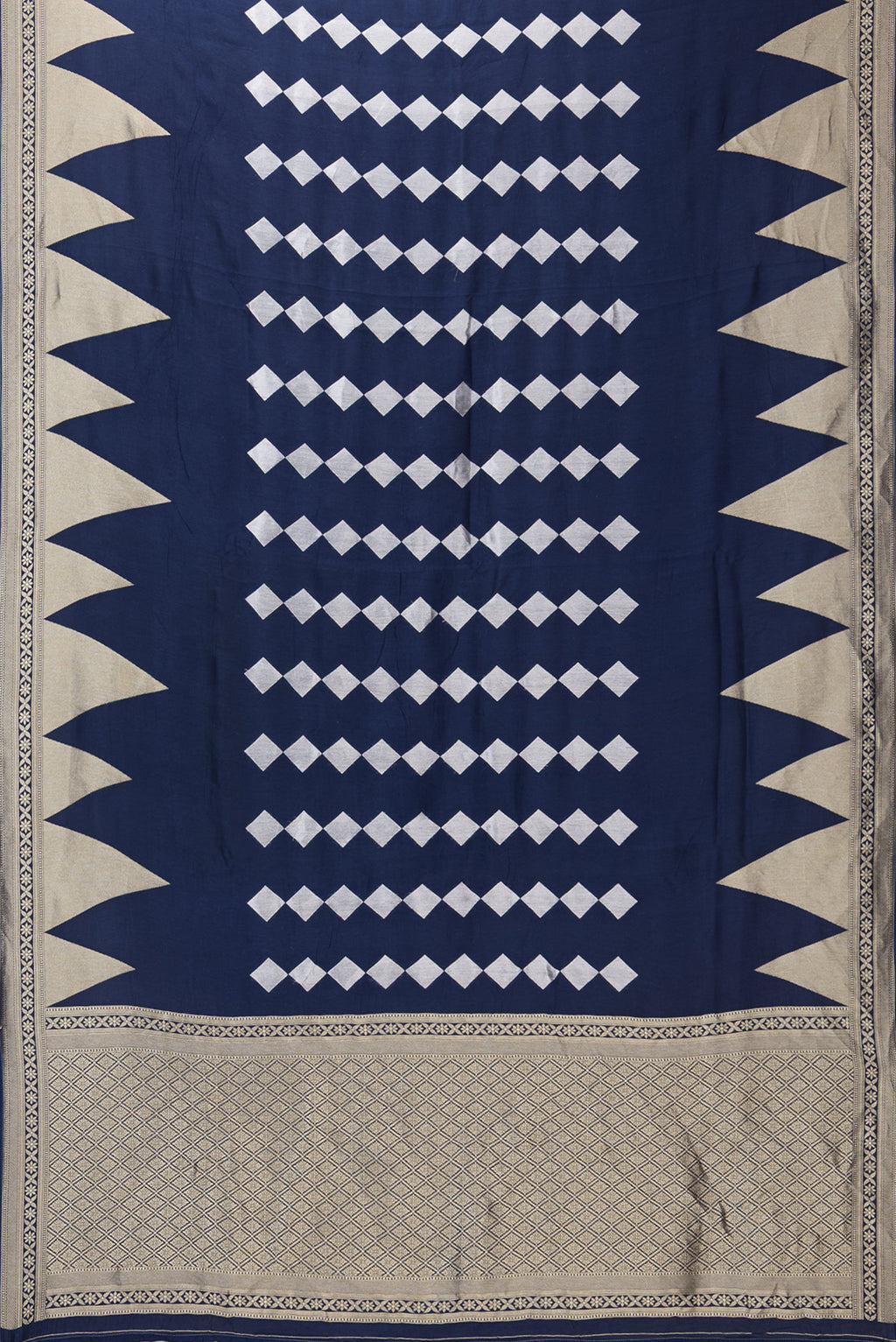 Flat view of Navy Blue Blended Banarasi Silk Saree with Zari Butta on the body and Fancy Border. 