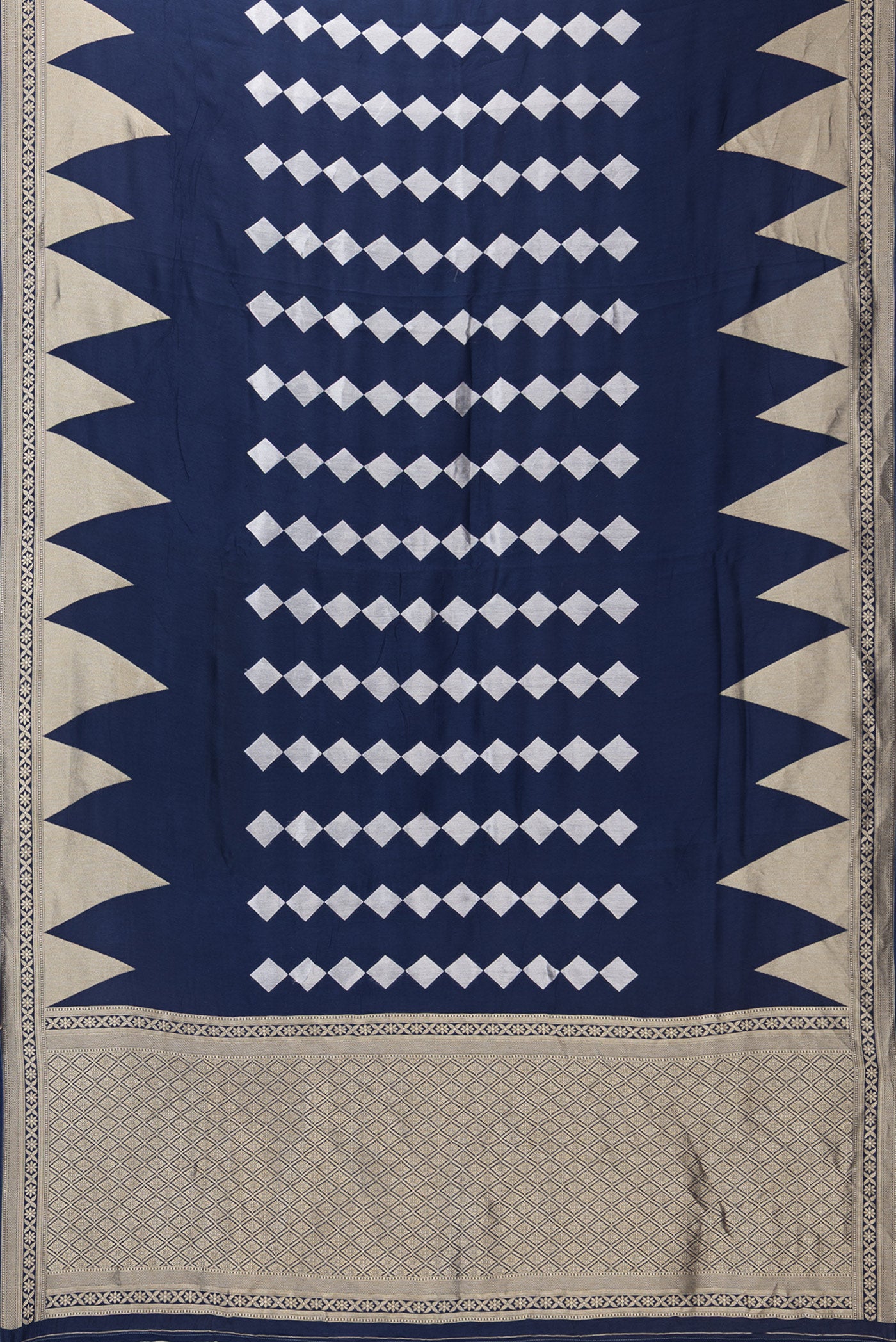 Flat view of Navy Blue Blended Banarasi Silk Saree with Zari Butta on the body and Fancy Border. 