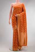 Brick Orange Blended Banarasi Georgette Saree with Zari Brocade on the body and Zari Border.  displayed on a mannequin