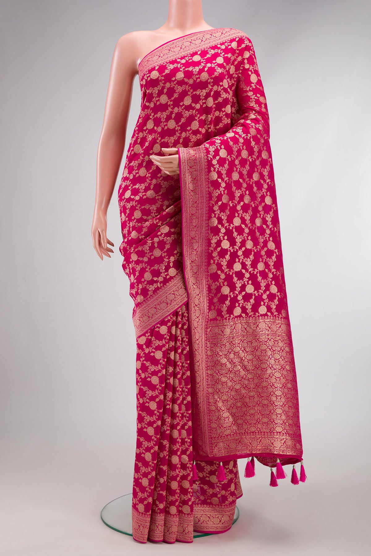 Pink Blended Banarasi Georgette Saree with Zari Brocade on the body and Zari Border.  displayed on a mannequin