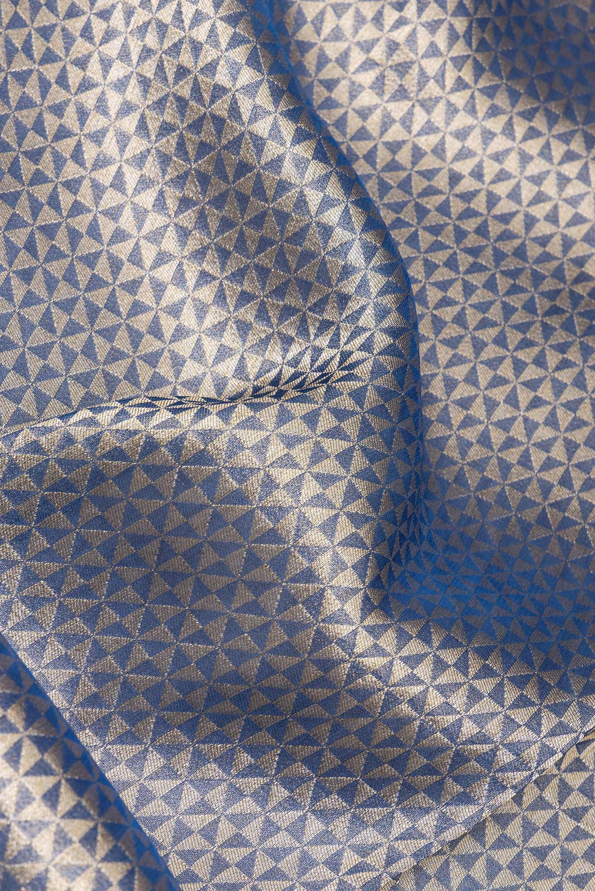 Close up of Navy Blue Dual Tone Blended Banarasi Silk Saree with Zari Brocade on the body and Zari Border.  displaying folds