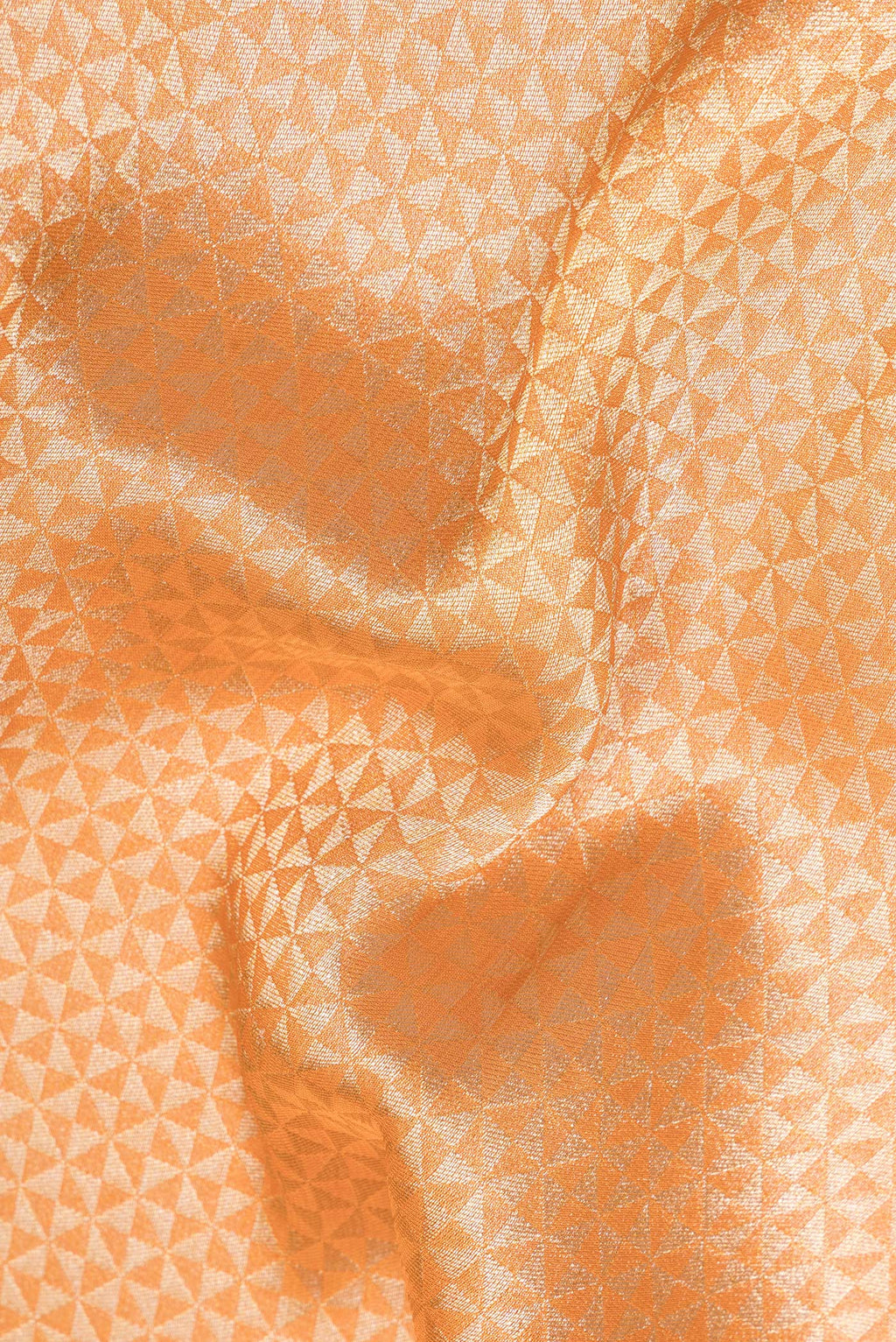 Close up of Orange Dual Tone Blended Banarasi Silk Saree with Zari Brocade on the body and Zari Border.  displaying folds