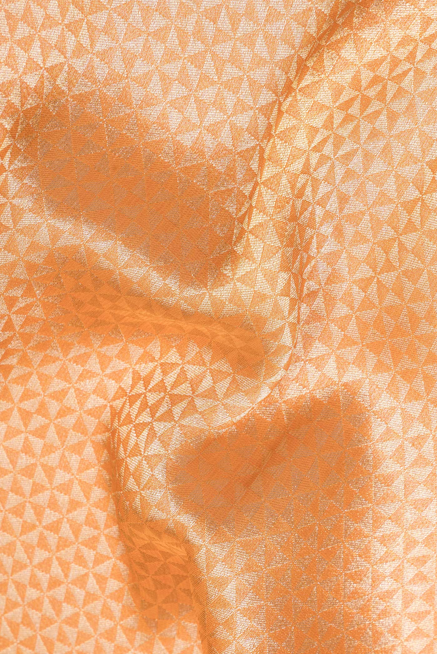 Close up of Orange Dual Tone Blended Banarasi Silk Saree with Zari Brocade on the body and Zari Border.  displaying folds