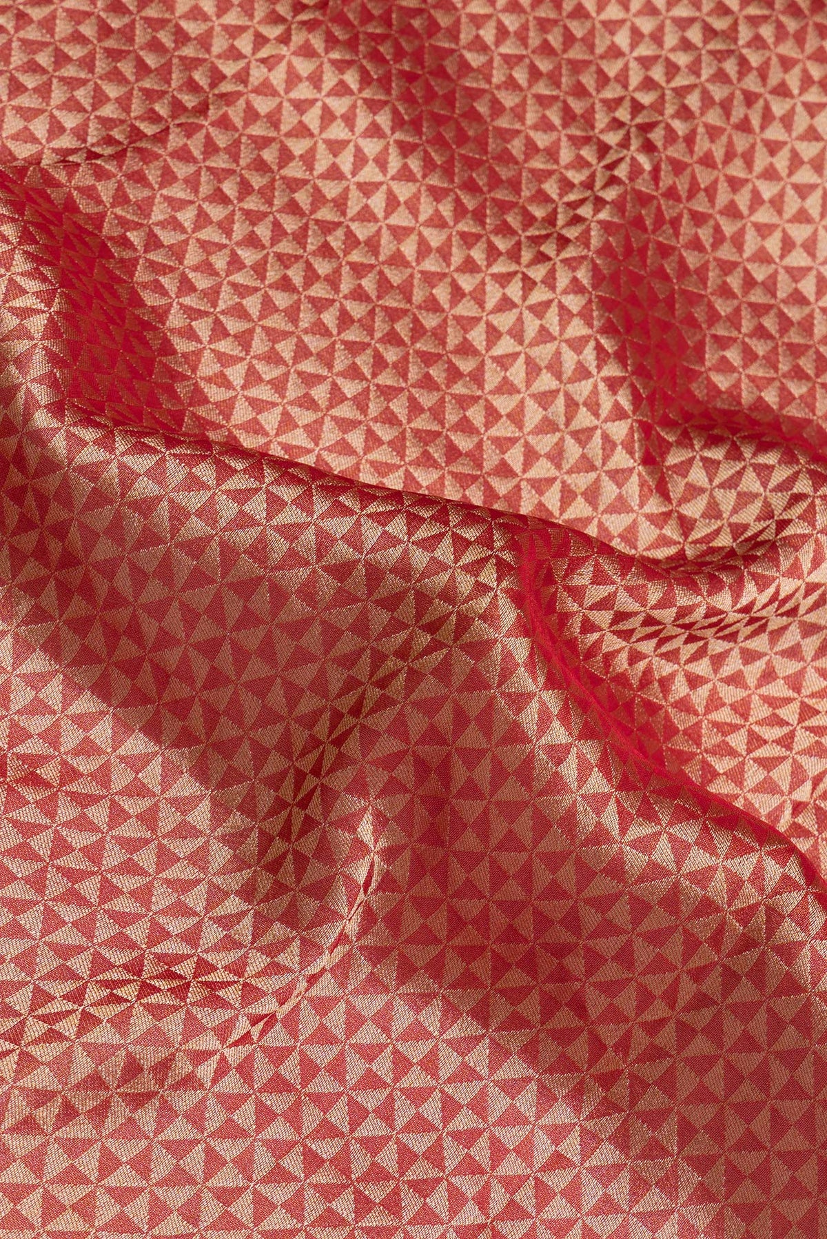 Close up of Red Blended Banarasi Silk Saree with Zari Brocade on the body and Fancy Border.  displaying folds