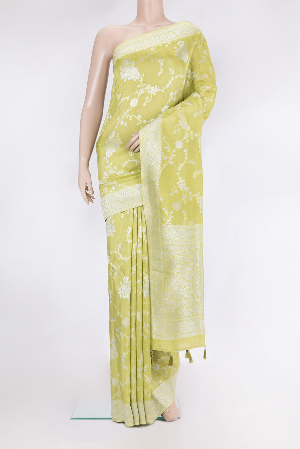 Pista Green Blended Banarasi Silk Saree with Zari Brocade on the body and Fancy Border.  displayed on a mannequin