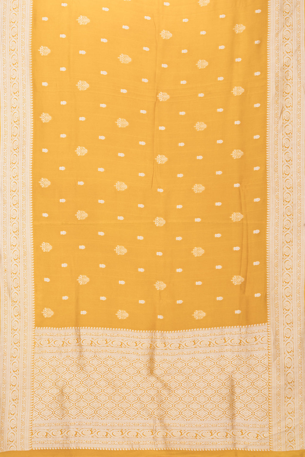 Flat view of Mustard Blended Banarasi Silk Saree with Zari Butta on the body and Fancy Border. 