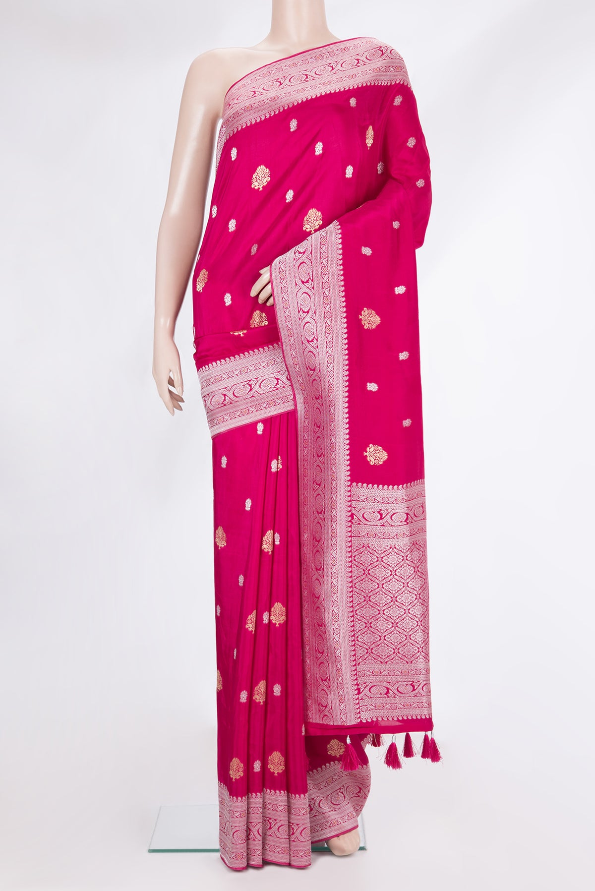 Dark Pink Blended Banarasi Silk Saree with Zari Butta on the body and Fancy Border.  displayed on a mannequin