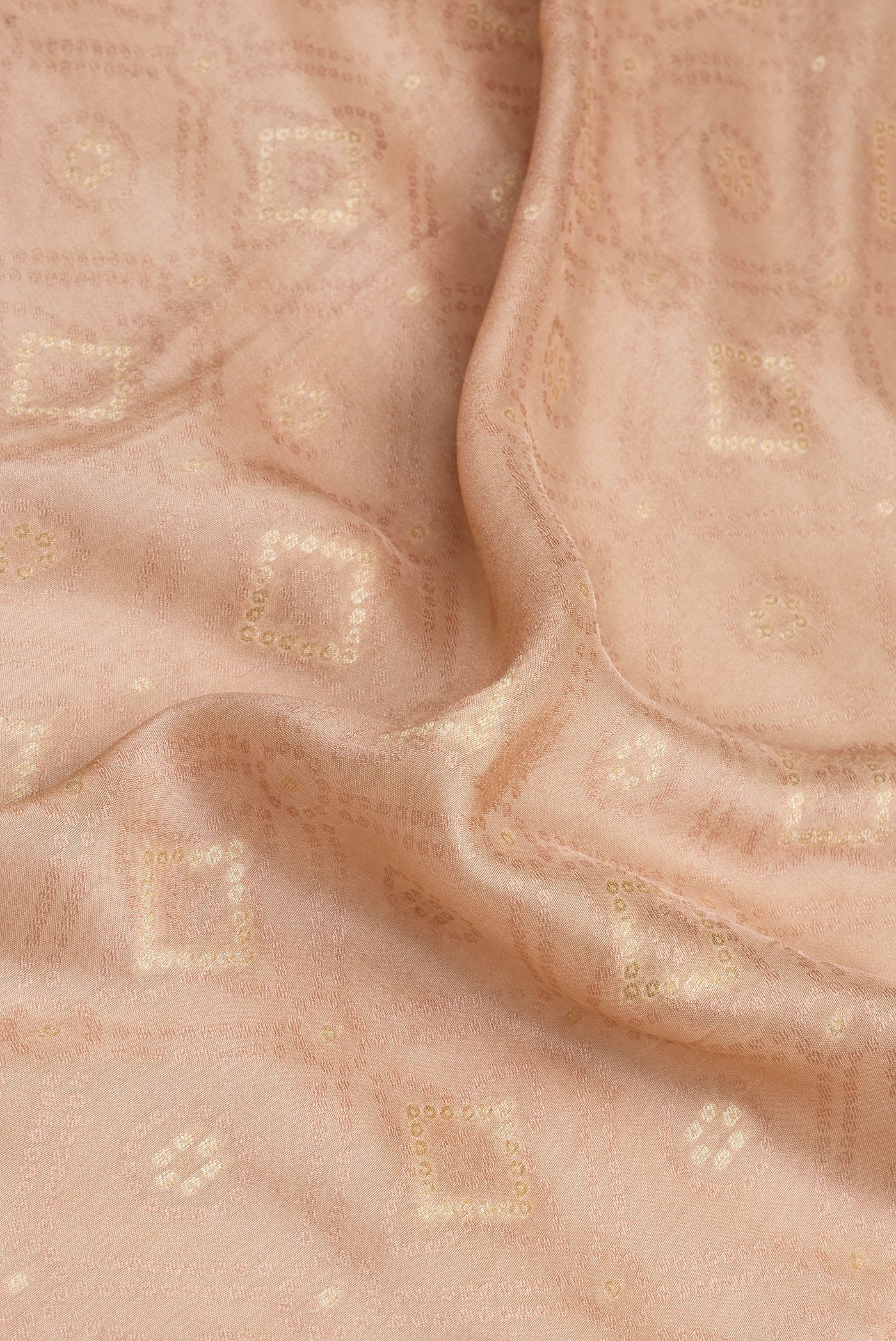 Close up of Peach Blended Banarasi Silk Saree with Jacquard With Zari Butta on the body and Fancy Border.  displaying folds