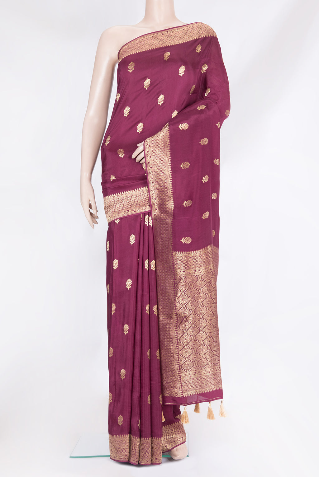 Magenta Blended Banarasi Silk Saree with Zari Butta on the body and Fancy Border.  displayed on a mannequin
