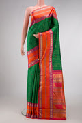 Pure Silk Pure Zari Green Dual Tone Kanjivaram Saree with Checked design on the body and Zari And Thread Border.  displayed on a mannequin
