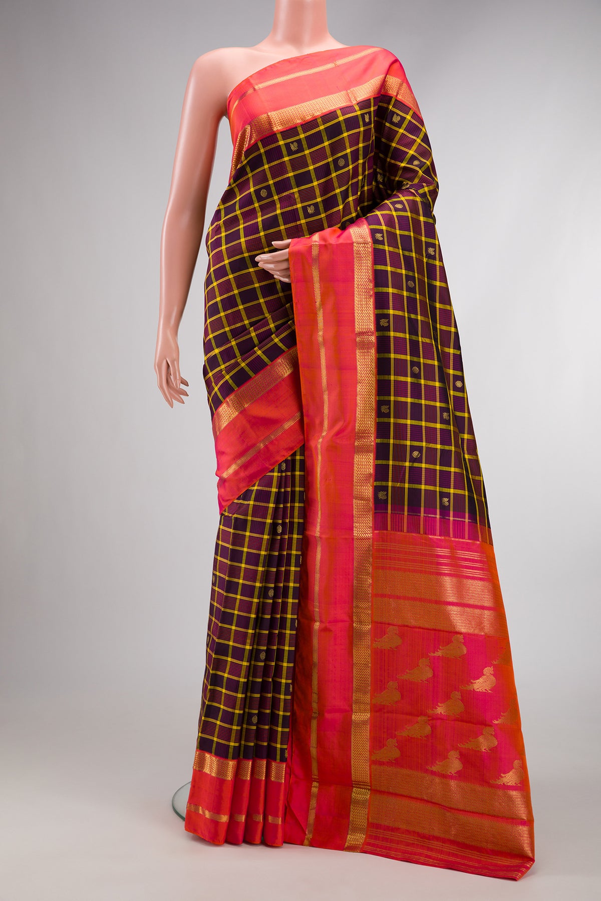Pure Silk Pure Zari Burgundy Dual Tone Kanjivaram Saree with Checked design on the body and Zari Border.  displayed on a mannequin
