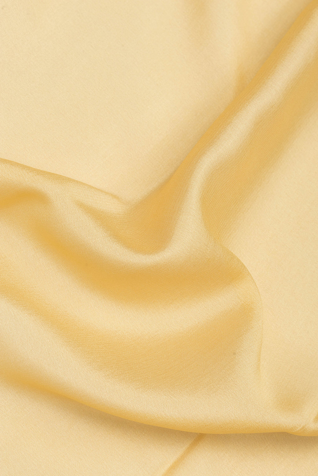Close up of Sandal Mysore Silk Saree with Plain Body and Zari Border.  displaying folds
