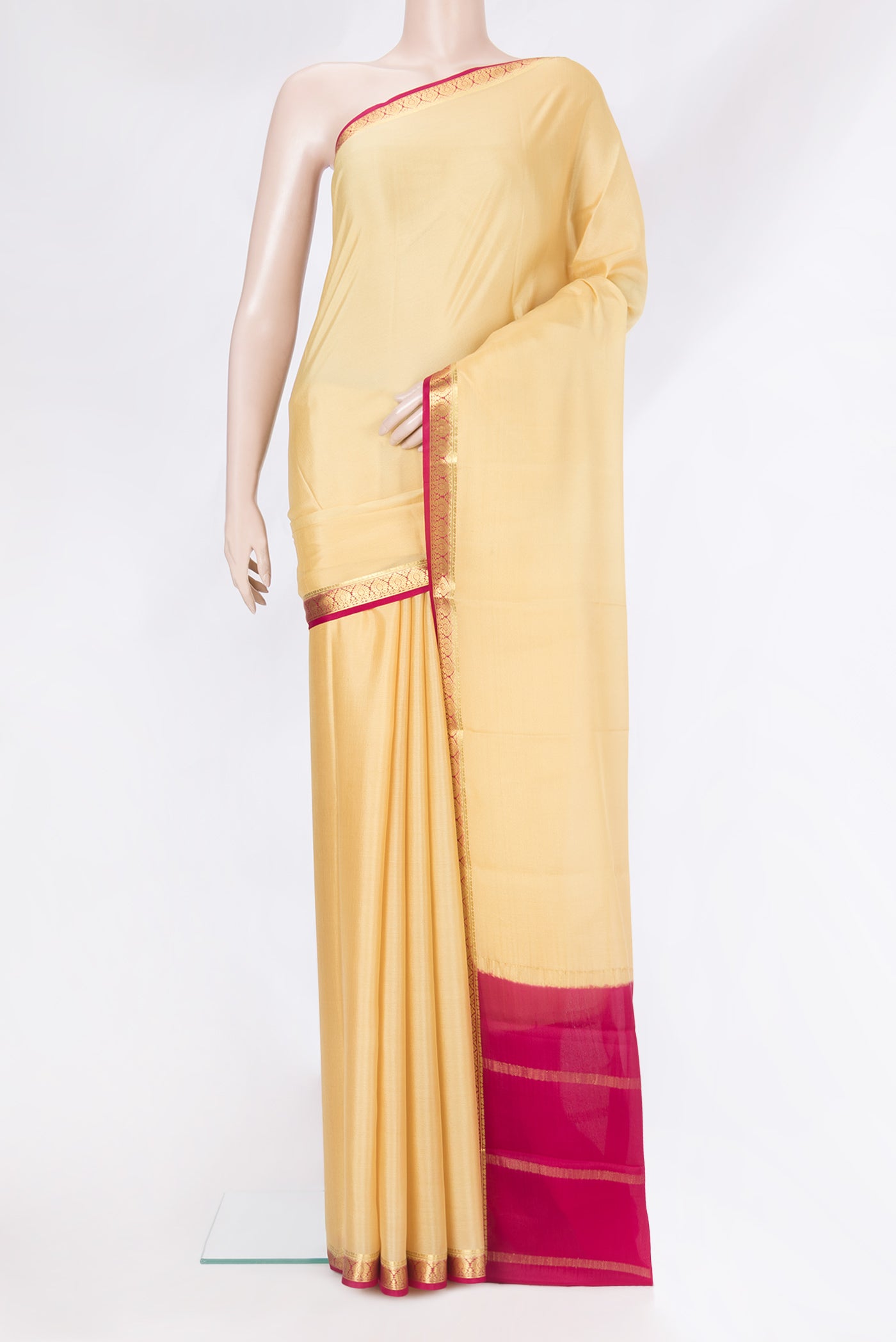 Sandal Mysore Silk Saree with Plain Body and Zari Border.  displayed on a mannequin