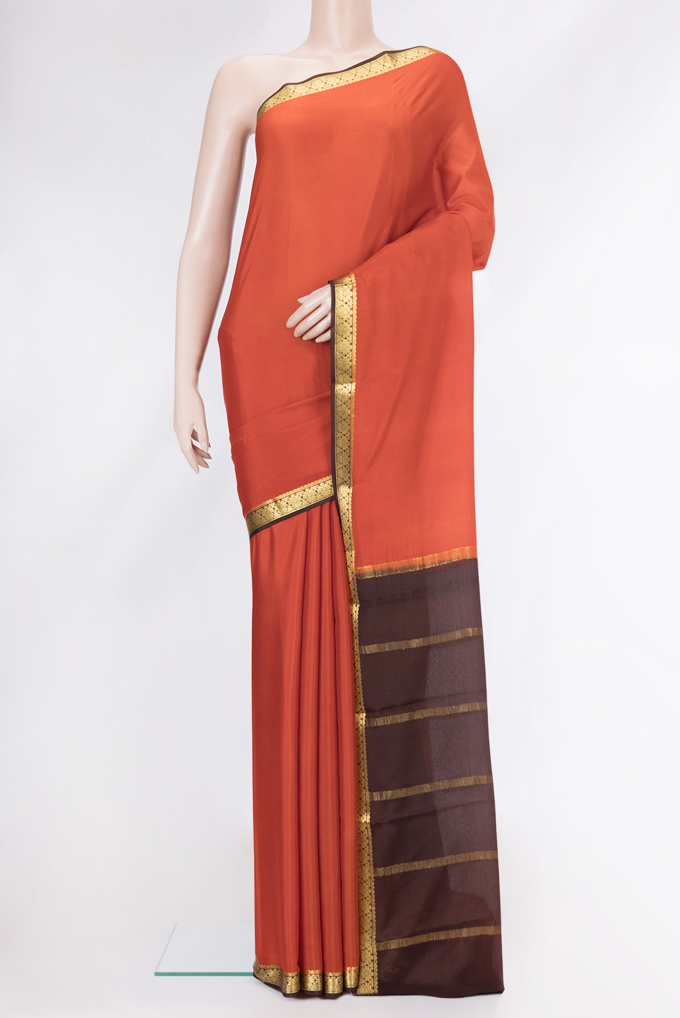 Orange Mysore Crepe Saree with Plain Body and Zari Border.  displayed on a mannequin