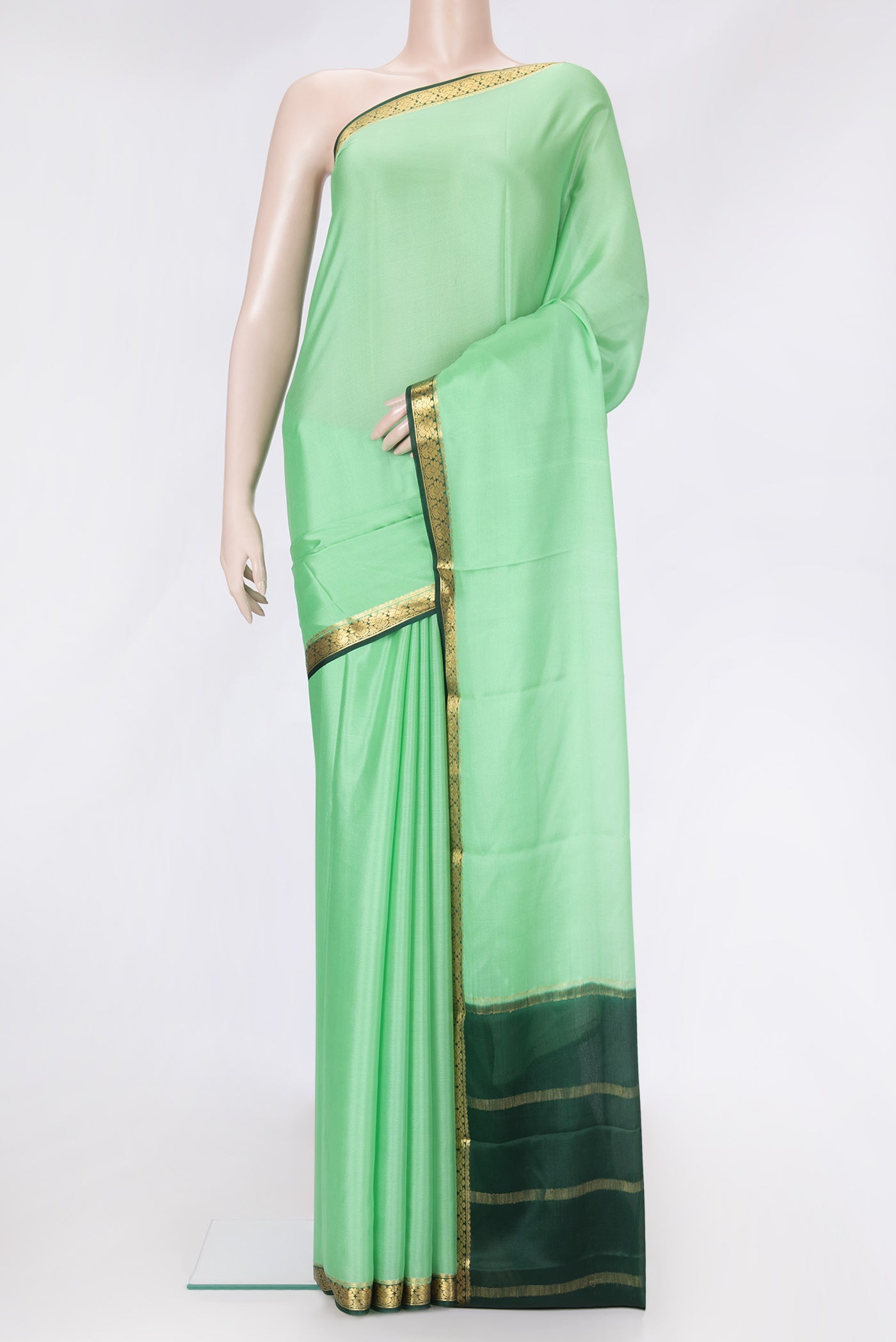 Pista Green Dual Tone Mysore Silk Saree with Plain Body and Zari Border.  displayed on a mannequin