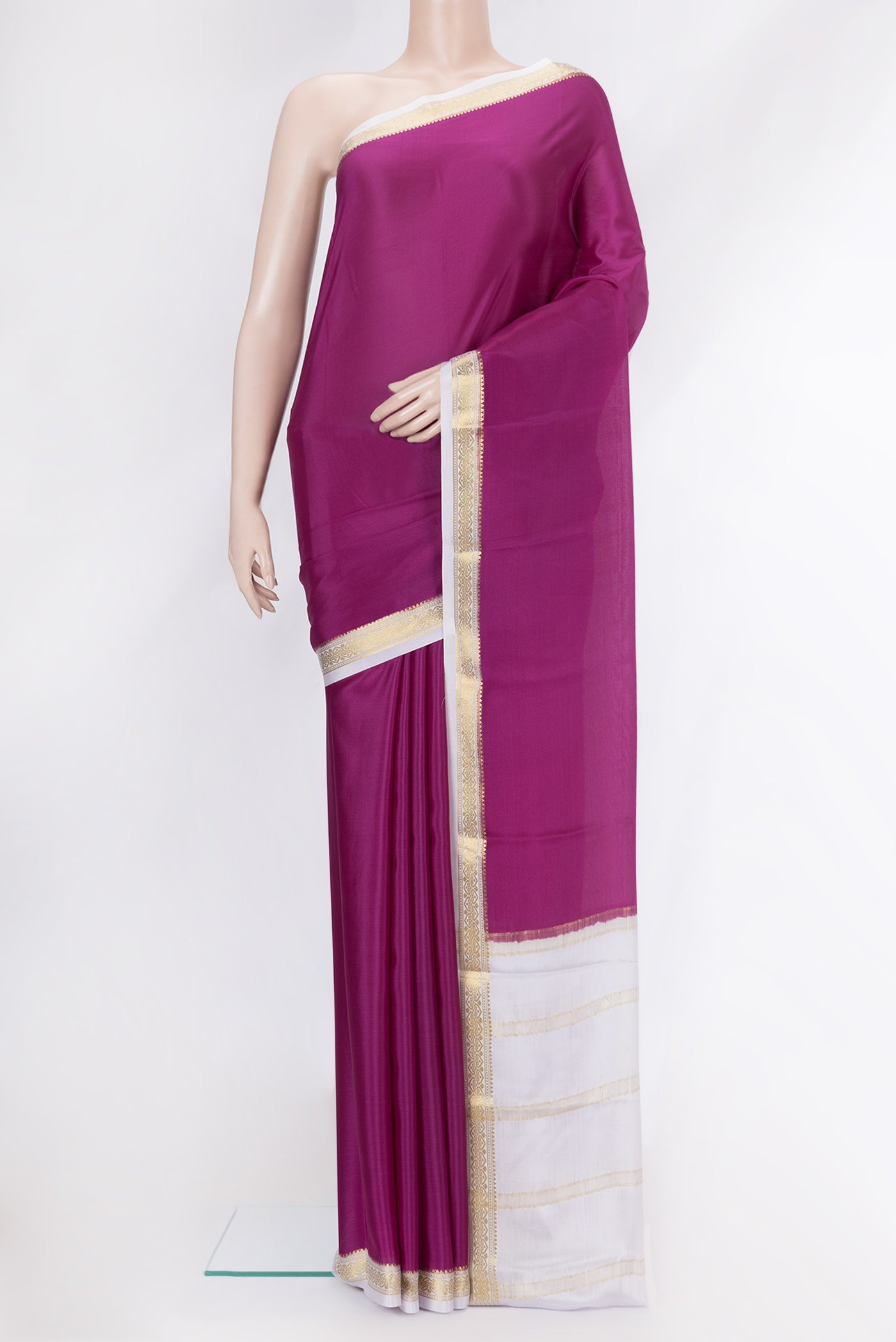Magenta Mysore Crepe Saree with Plain Body and Zari Border.  displayed on a mannequin