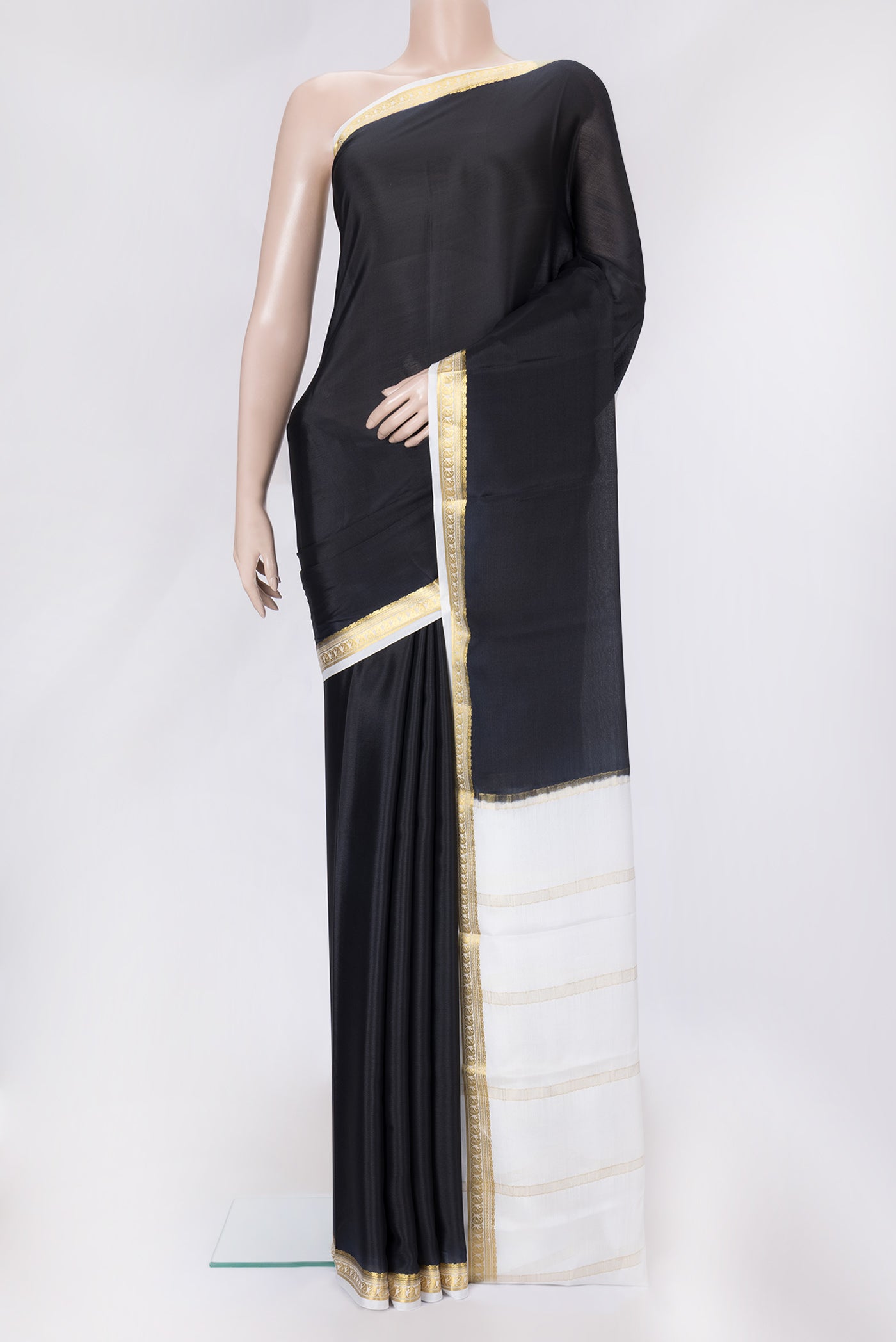 Black Dual Tone Mysore Silk Saree with Plain Body and Zari Border.  displayed on a mannequin