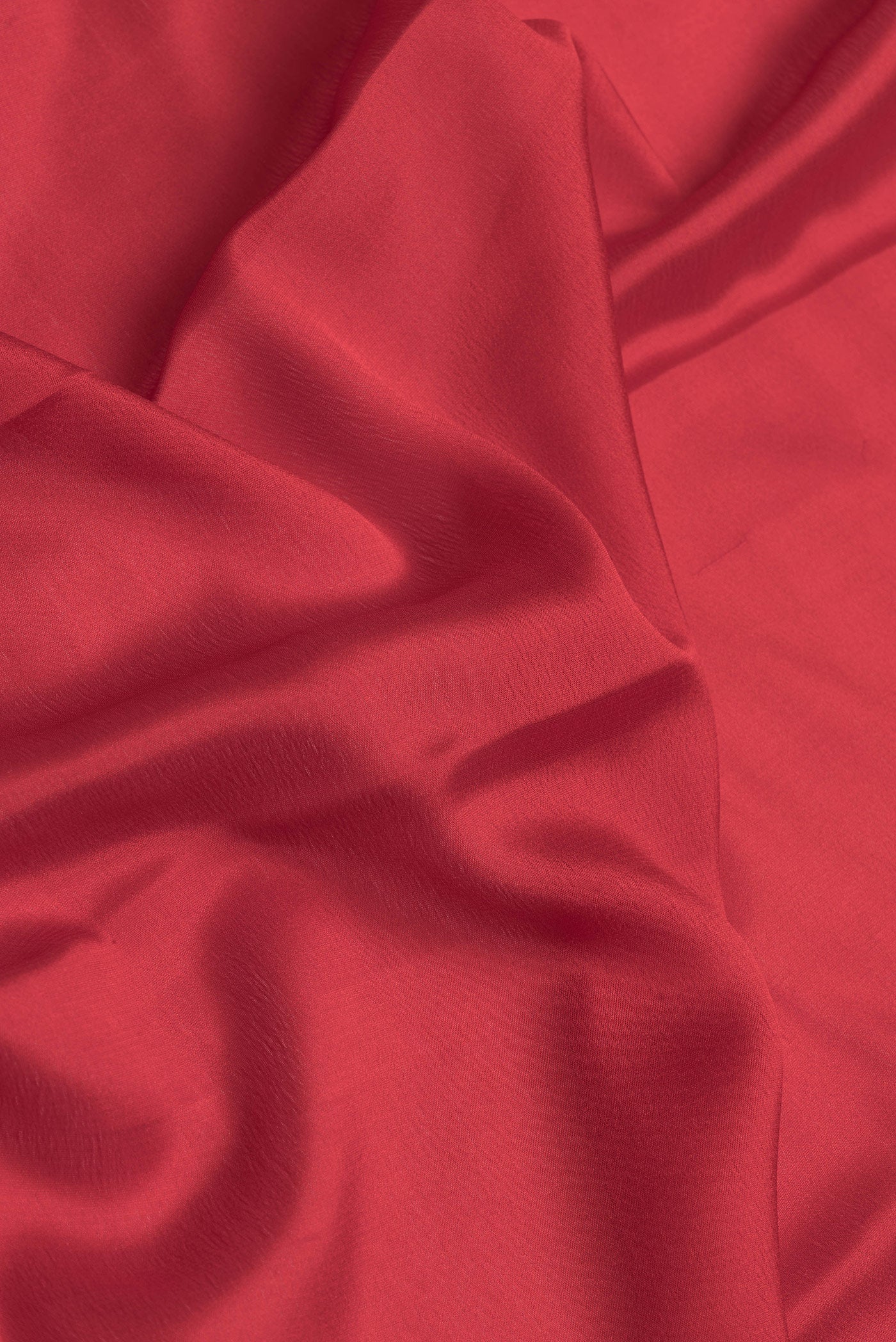 Close up of Red Dual Tone Mysore Silk Saree with Plain Body and Zari Border.  displaying folds