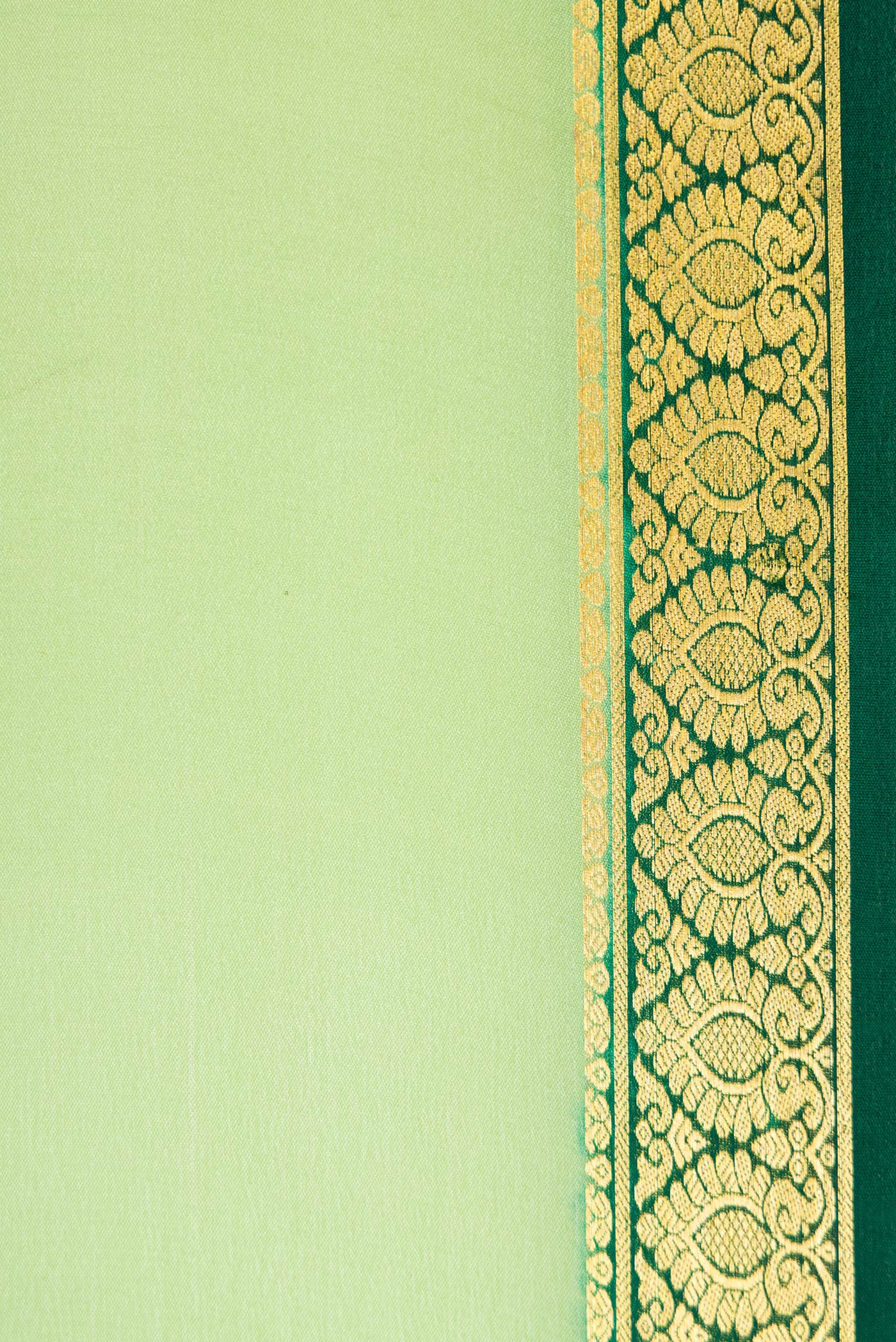 Border image of Pista Green Dual Tone Mysore Crepe Saree with Plain Body and Zari Border. 